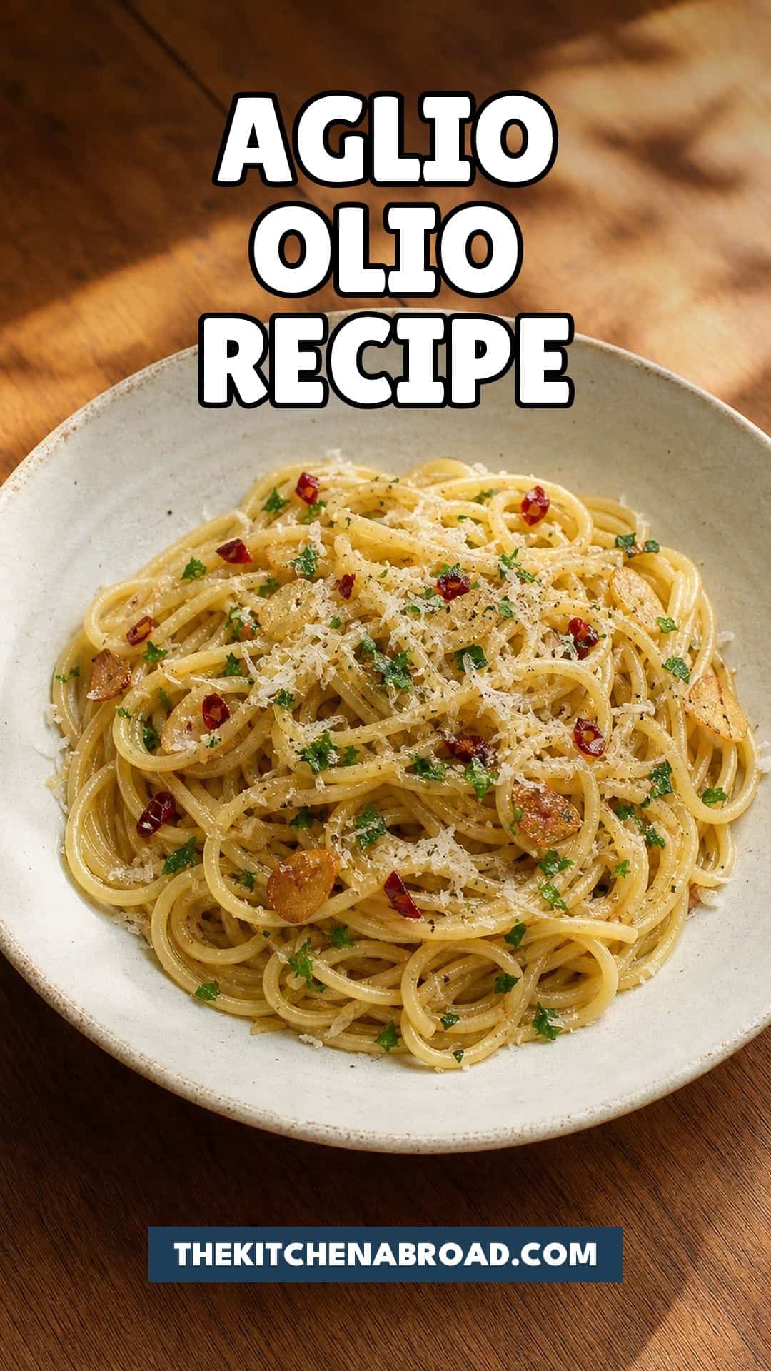 Spaghetti Aglio e Olio Recipe (Italian Garlic Pasta) Spaghetti aglio e olio recipe pin with garlic olive oil pasta in a rustic bowl.