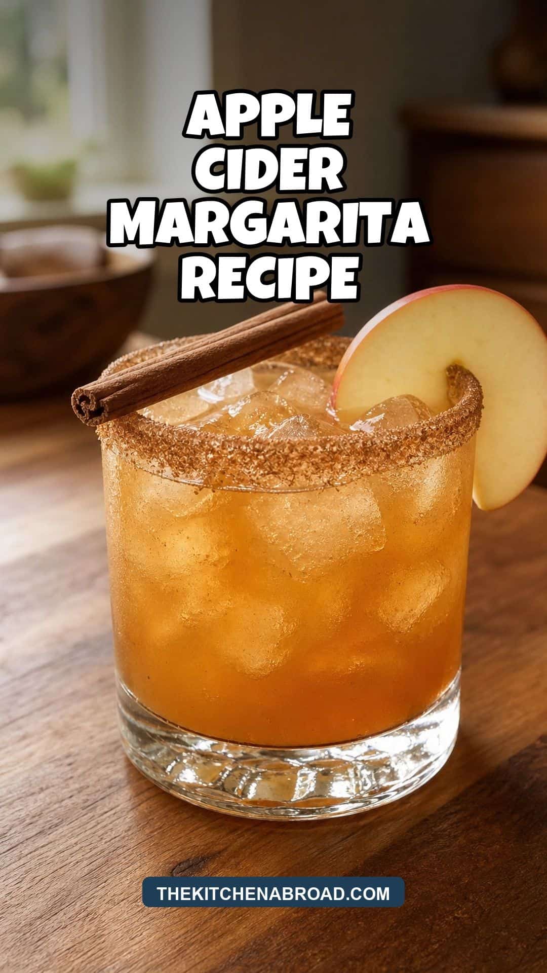 Apple cider margarita recipe pin with a cozy fall margarita on a rustic kitchen surface