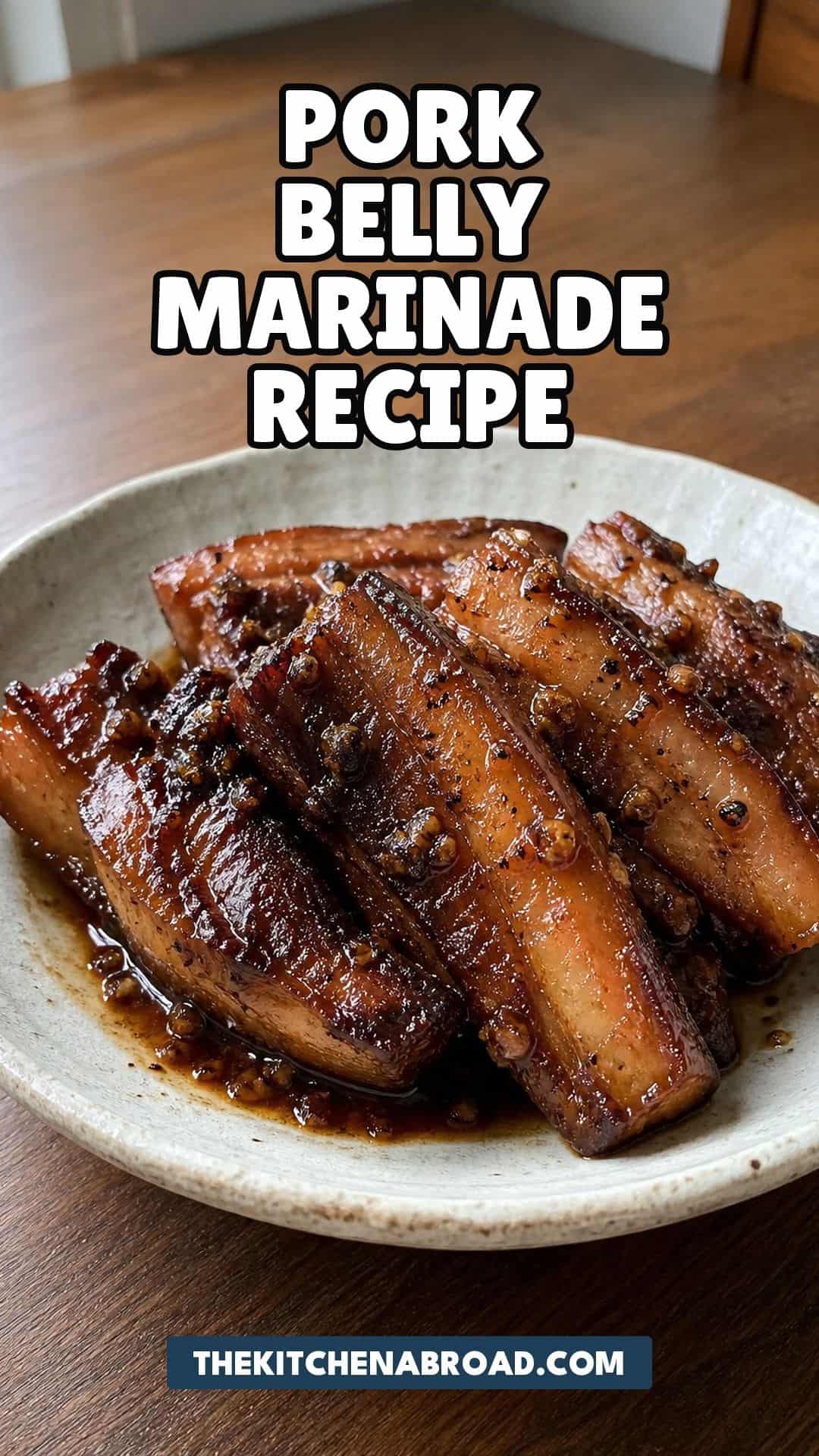 Asian style pork belly marinade recipe with sticky soy honey glazed pork belly in a ceramic bowl