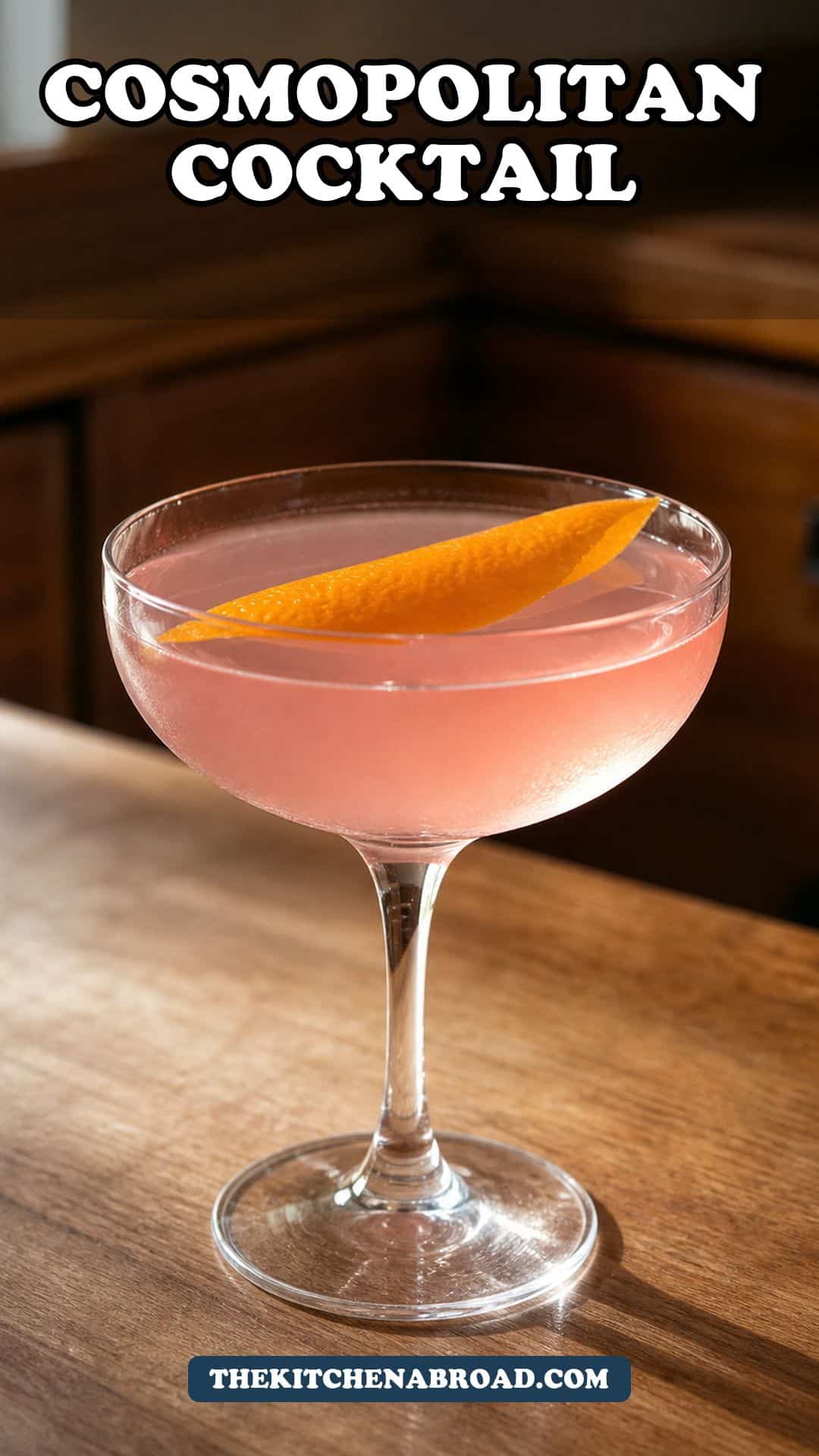 Cosmopolitan cocktail recipe pin with a pink cocktail and orange peel garnish