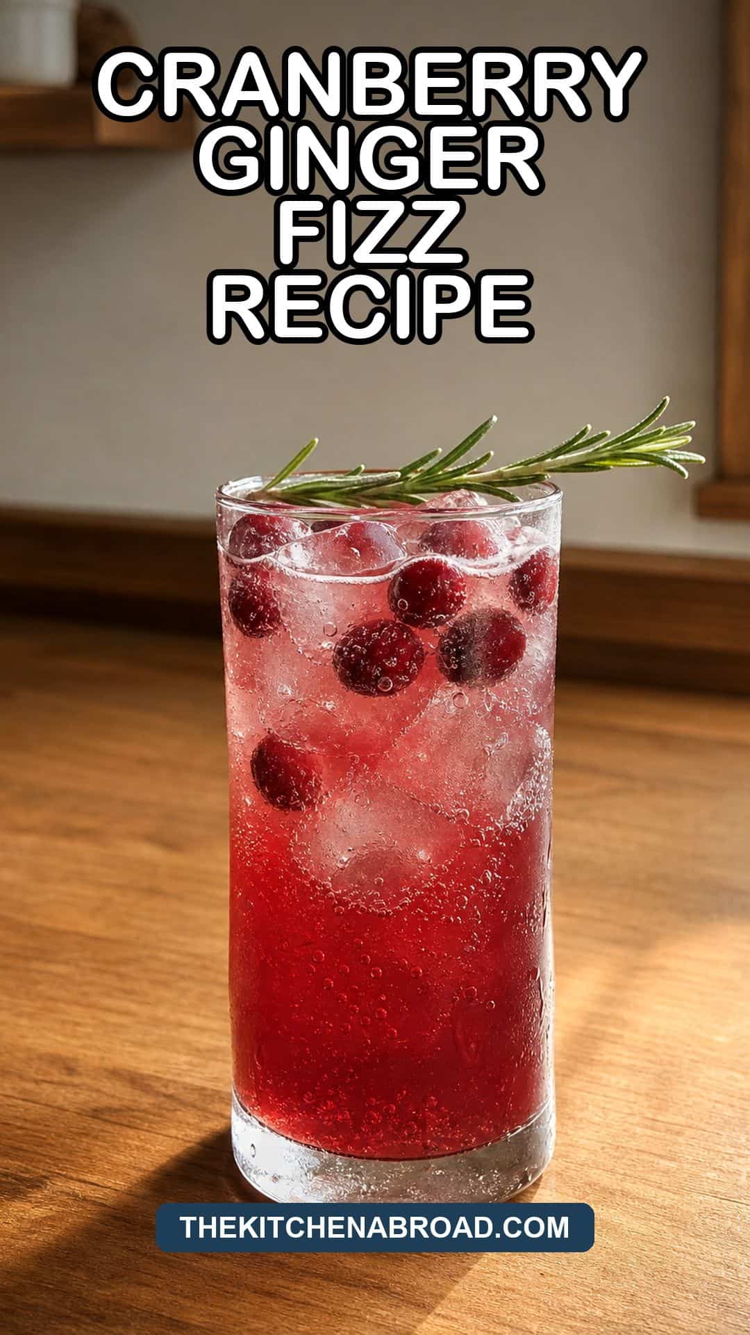 Cranberry Ginger Fizz Recipe pin with a sparkling cranberry ginger mocktail in a Collins glass.