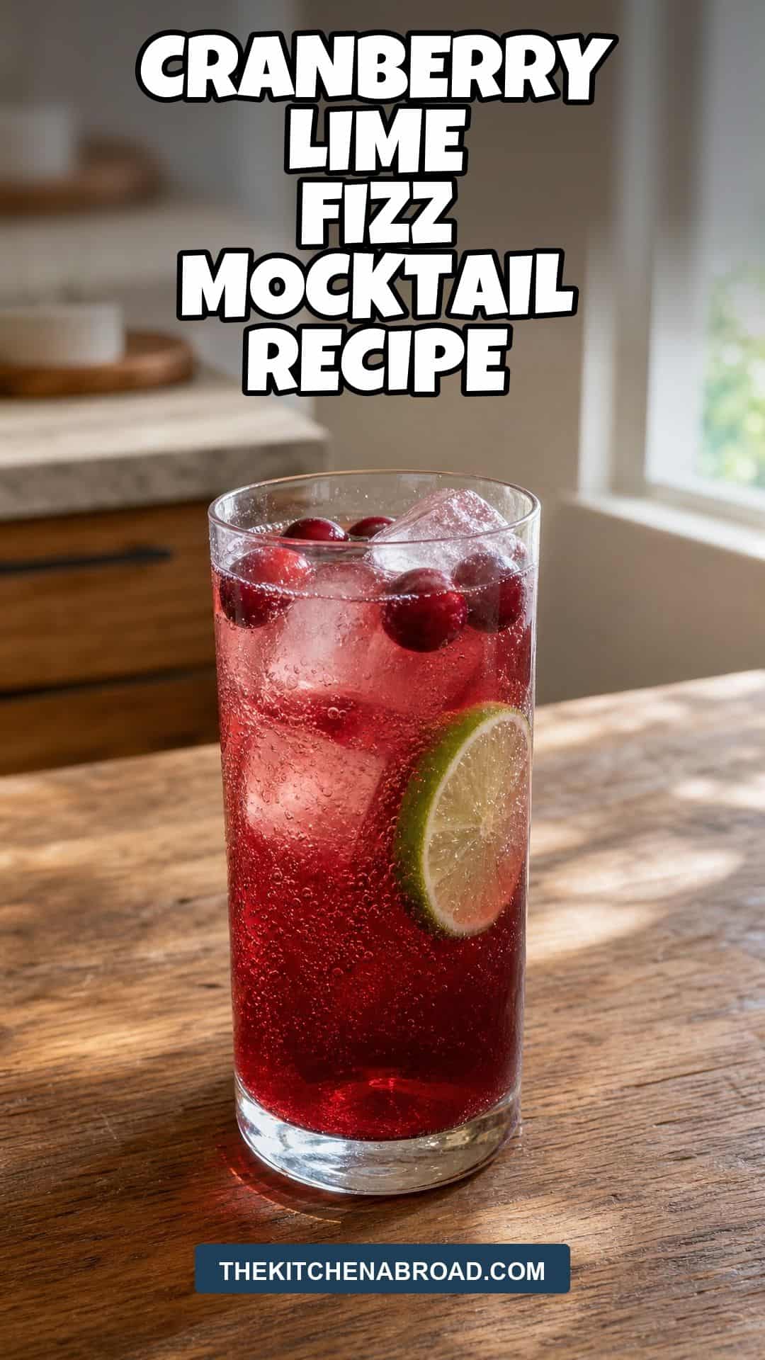Cranberry lime fizz mocktail recipe pin with a tall cranberry lime drink in a Collins glass.
