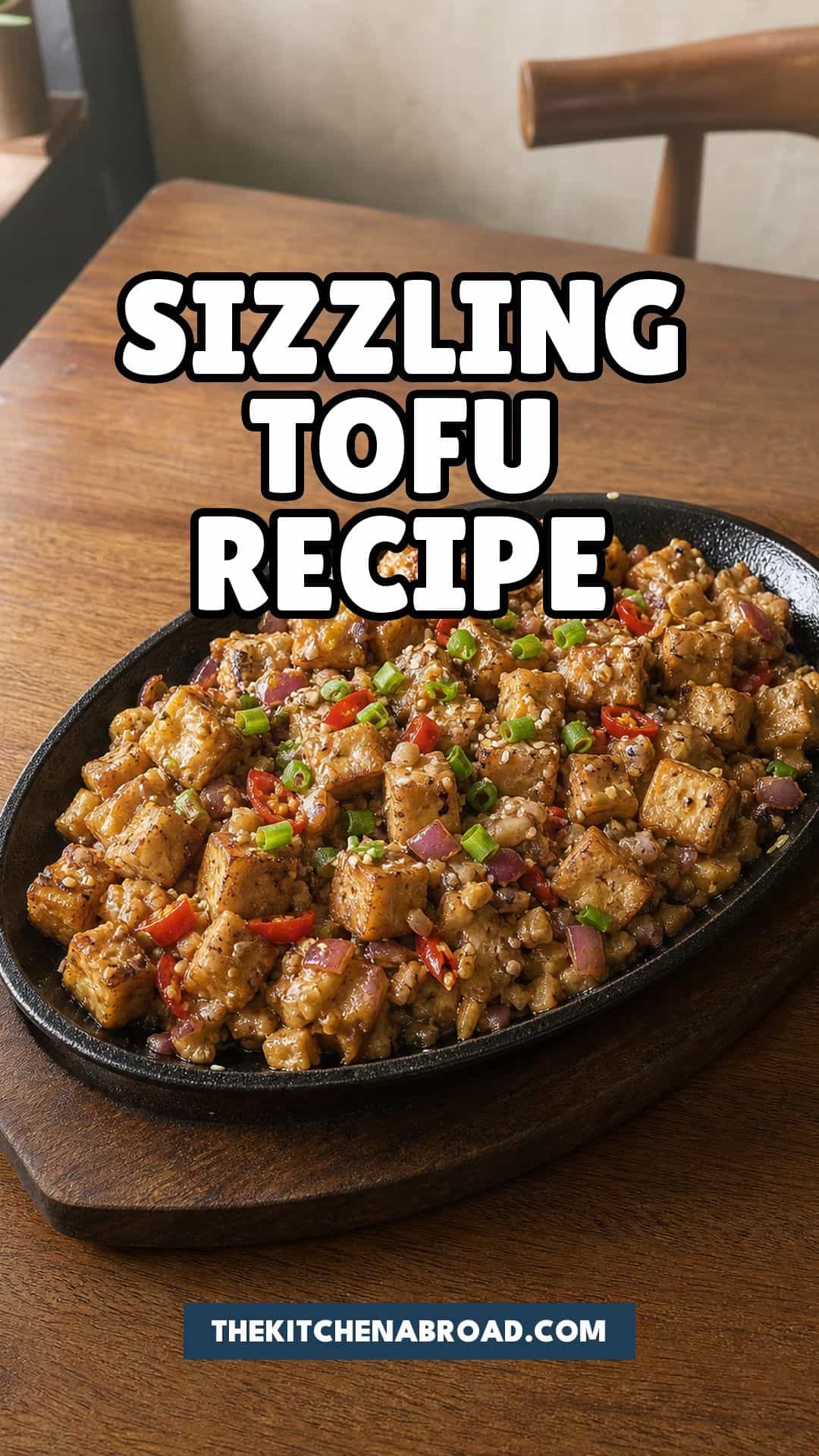 Crispy Tofu Sisig Recipe That Rivals the Pork Version Filipino style sizzling tofu recipe pin with crispy tofu sisig on a black sizzling plate.