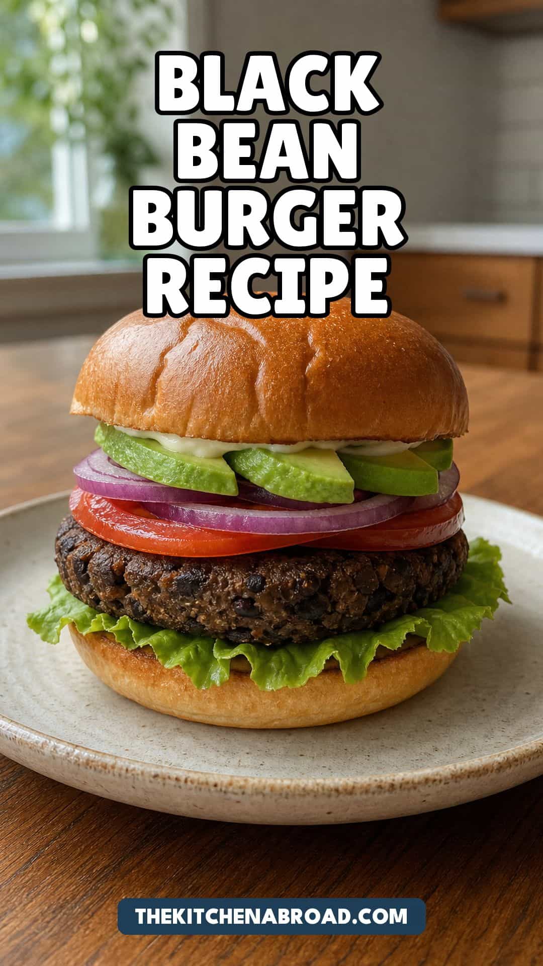 Homemade black bean burger recipe pin with a toasted brioche burger and avocado.