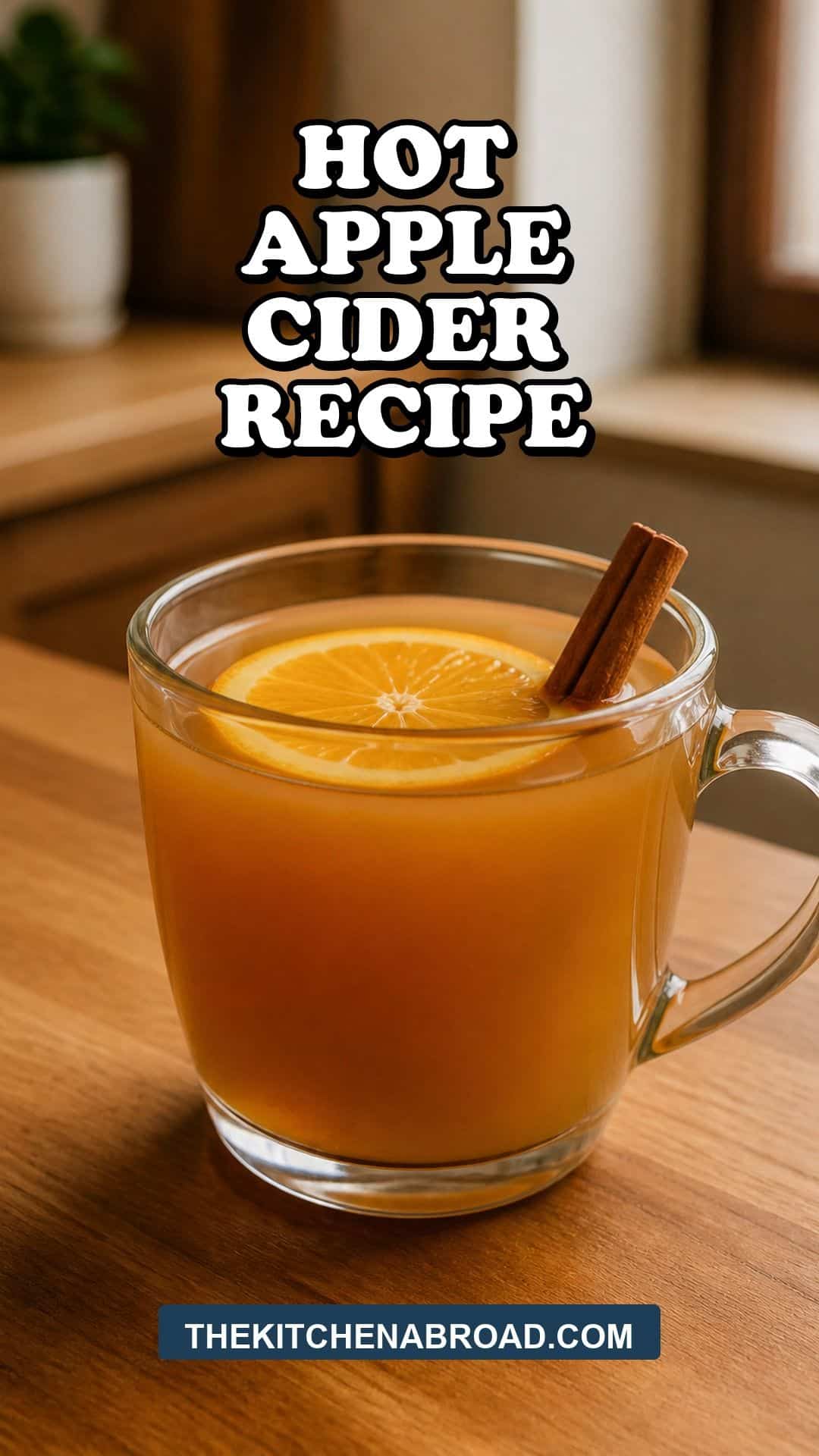 Hot Apple Cider Recipe Hot apple cider recipe pin with a clear mug of cider, orange round, and cinnamon stick.
