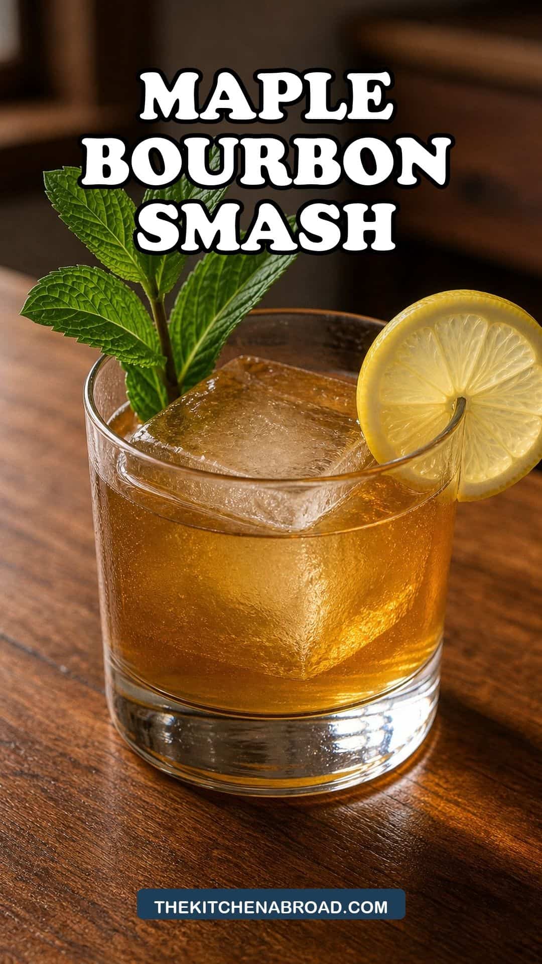 Maple Bourbon Smash cocktail with mint and lemon in a rocks glass