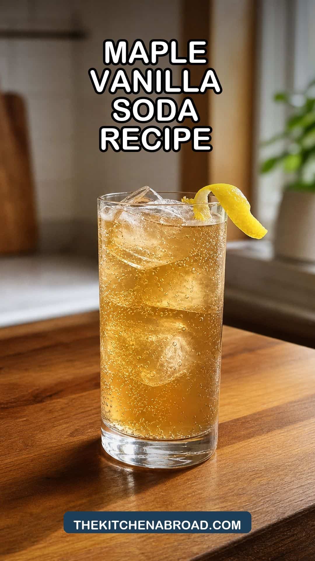 Maple Vanilla Soda Recipe Maple vanilla soda cocktail with ice and a lemon twist in a Collins glass