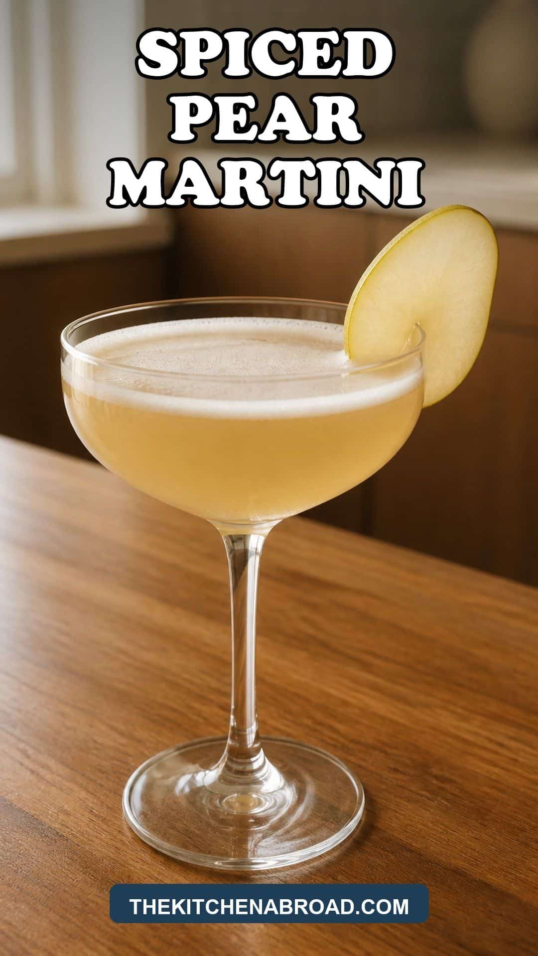 Spiced Pear Martini Recipe Spiced pear martini in a coupe glass with a pear slice garnish and bold recipe title text.