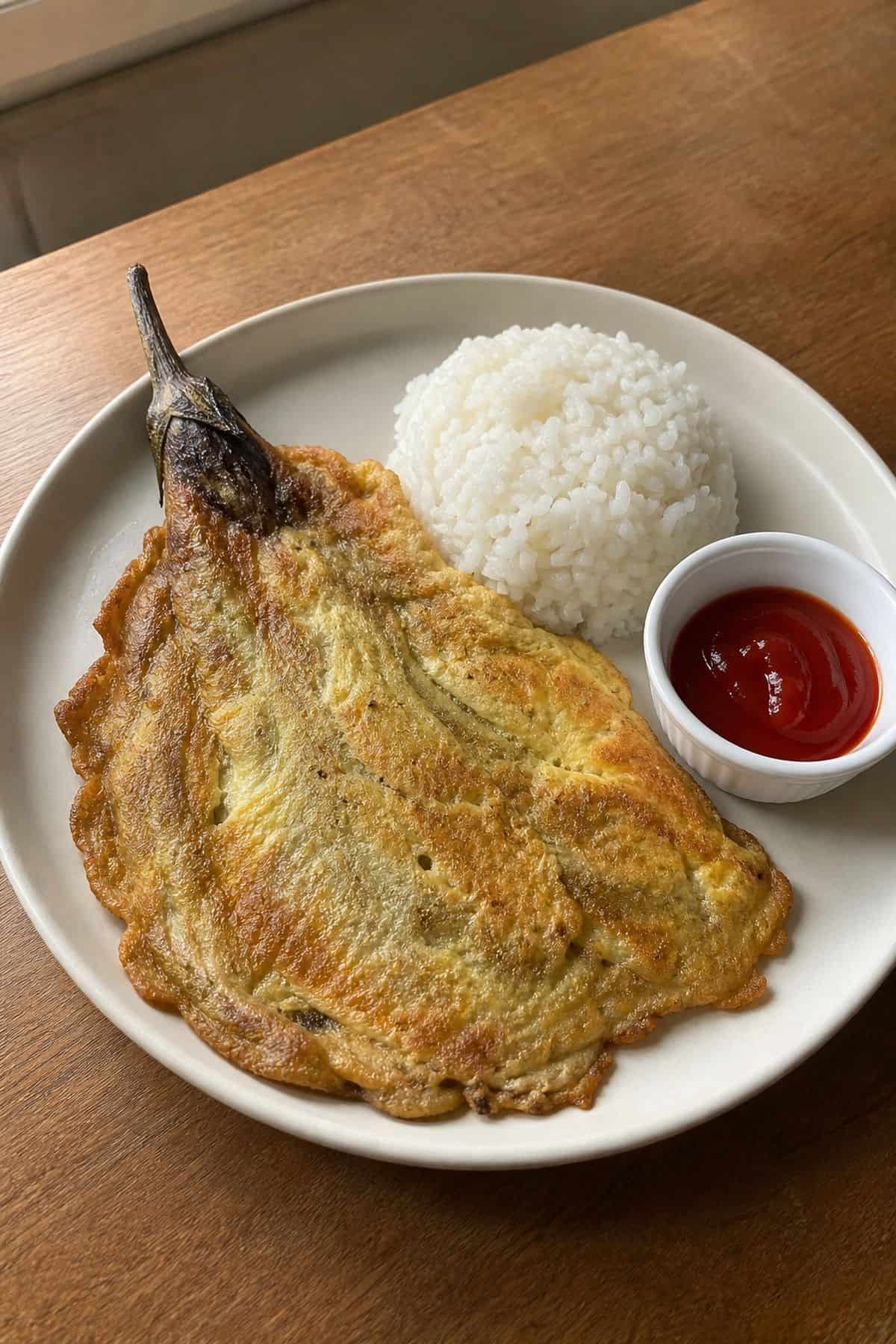 Tortang Talong Recipe (Filipino Eggplant Omelet) Tortang talong Filipino eggplant omelet served with steamed rice and banana ketchup.
