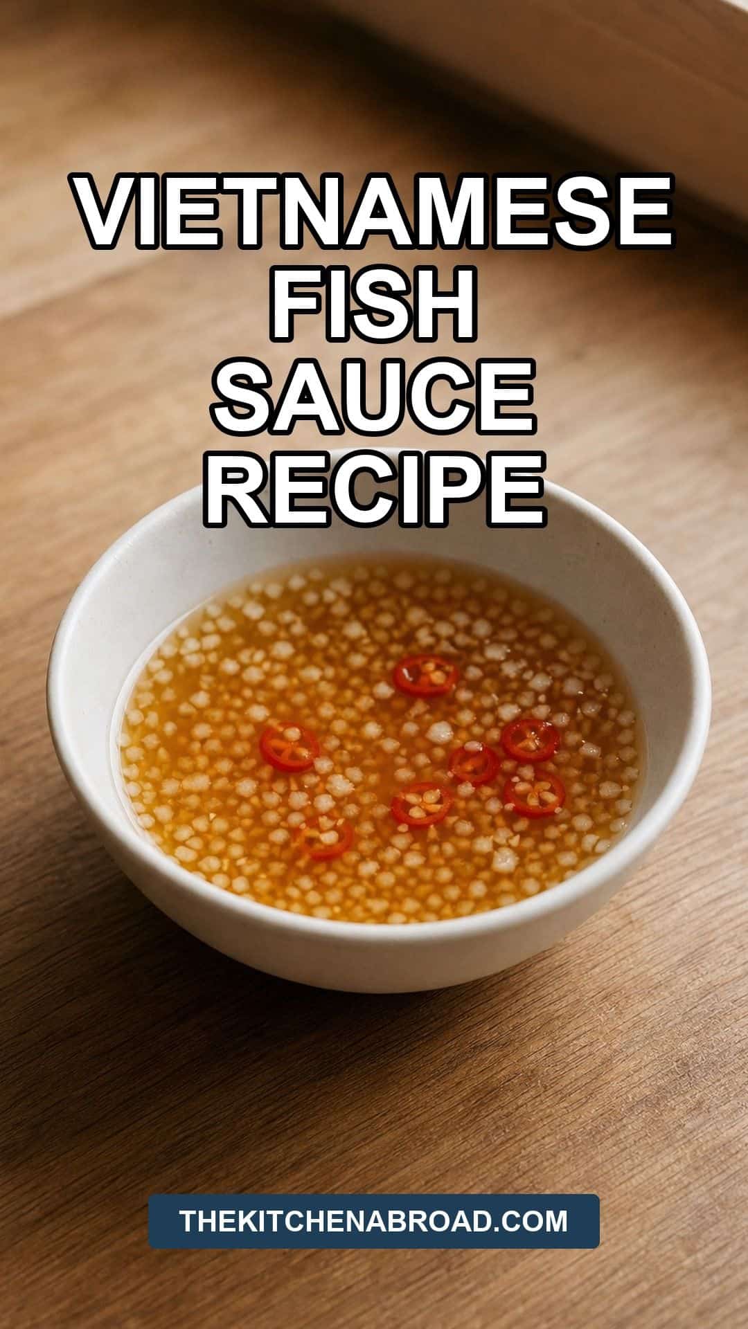 Vietnamese Fish Sauce Recipe: Nuoc Cham Dipping Sauce Pinterest pin for Vietnamese fish sauce recipe with nuoc cham dipping sauce in a white bowl