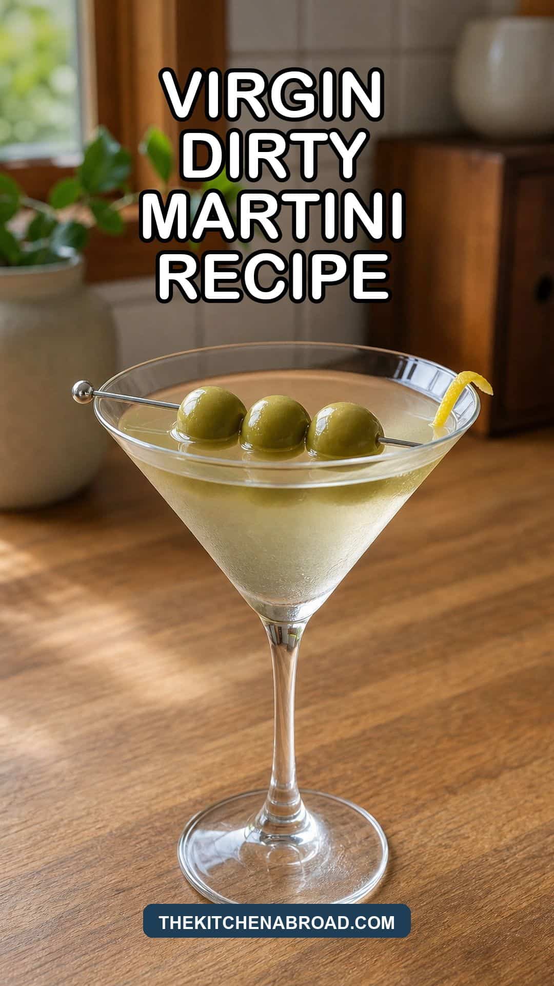 Virgin Dirty Martini Recipe pin with a chilled green olive mocktail in a martini glass.