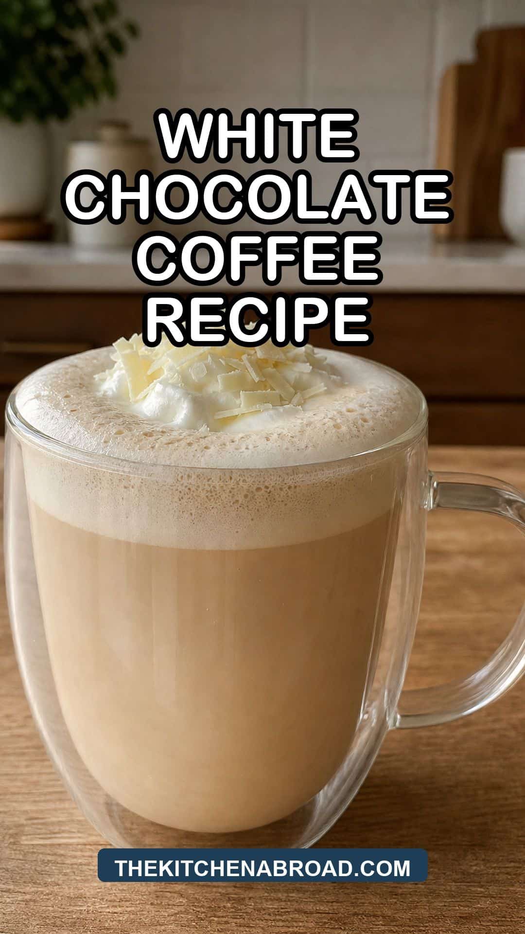 White Chocolate Coffee Recipe White chocolate coffee recipe in a glass mug with creamy foam and white chocolate shavings