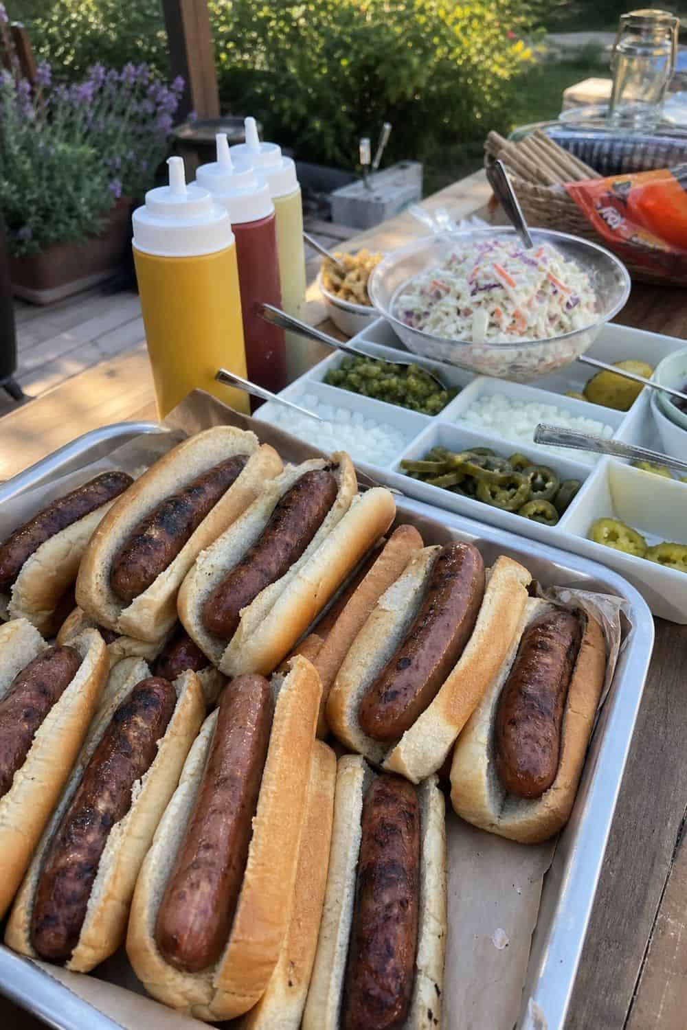 25 Backyard BBQ Food Ideas for a Crowd-Pleasing Summer Menu 2. Hot Dog and Sausage Topping Bar for backyard BBQ food ideas