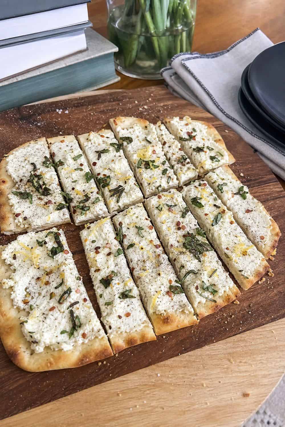 25 Book Club Food Ideas for Easy Conversation and Snacking 9. Slice Herbed Ricotta Flatbread for book club food ideas