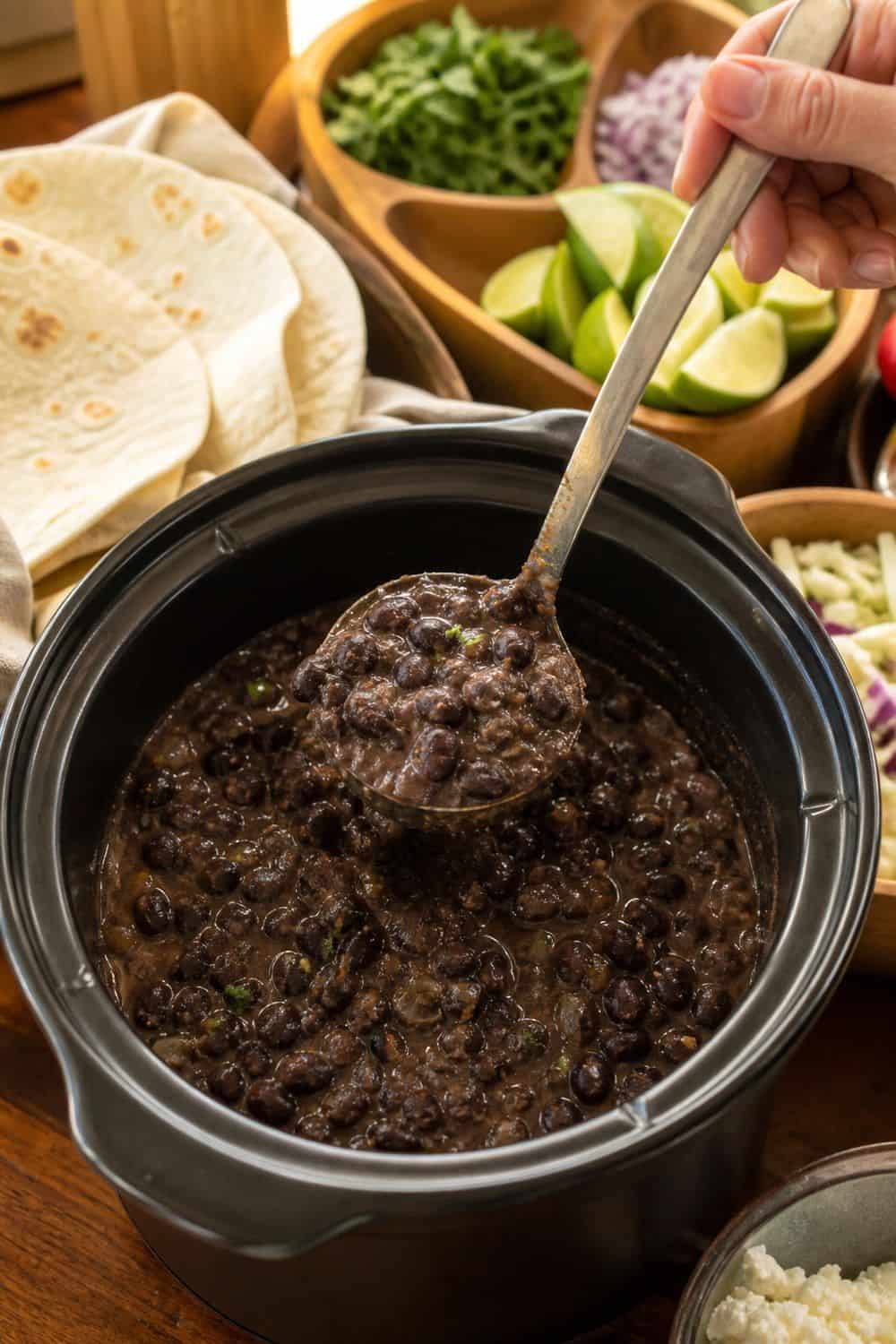 25 Cinco de Mayo Taco Bar Ideas for a Colorful Self-Serve Spread cinco de mayo taco bar ideas section 07 put spiced black beans in a warm pot