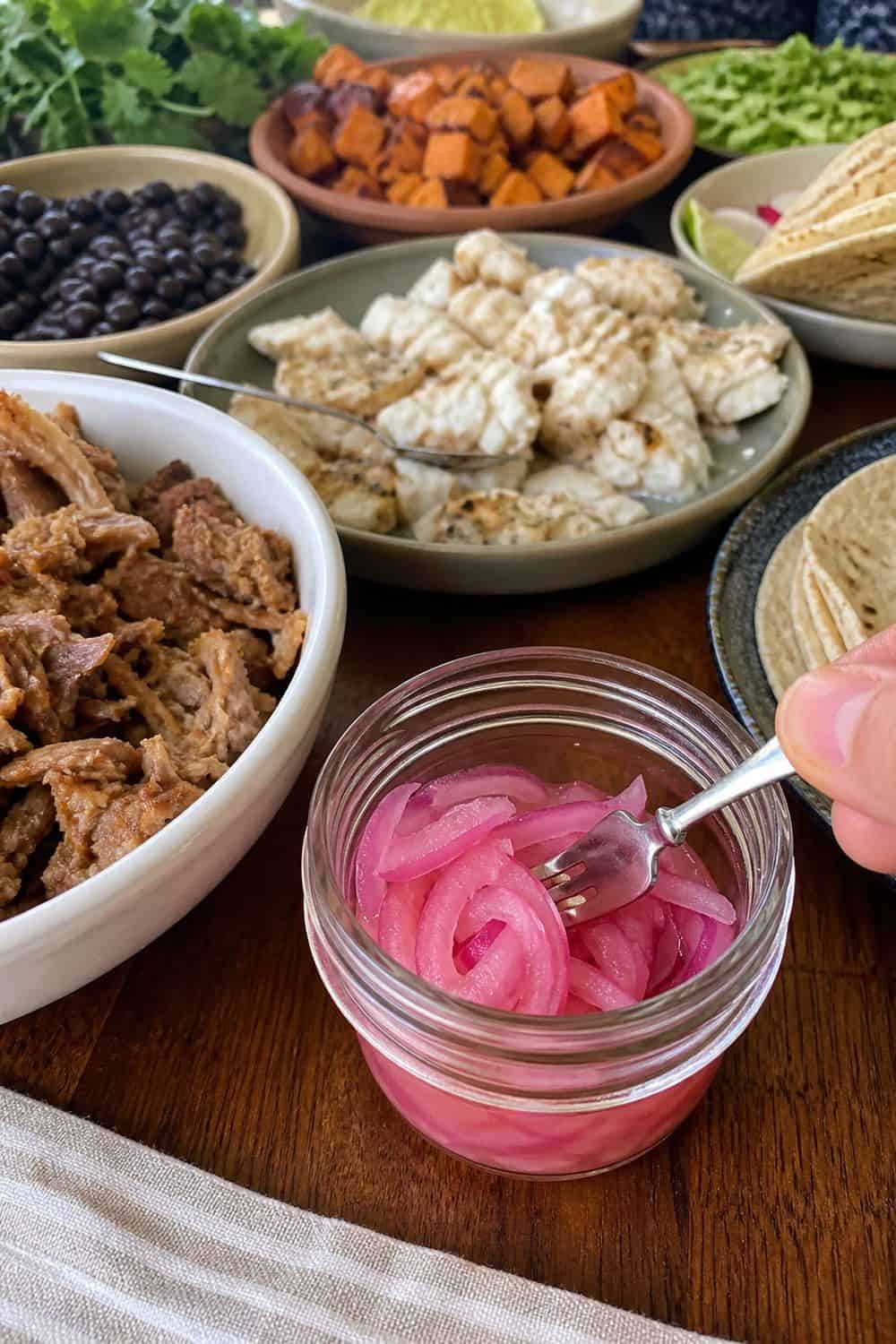 25 Cinco de Mayo Taco Bar Ideas for a Colorful Self-Serve Spread cinco de mayo taco bar ideas section 14 put pickled red onions in a small jar