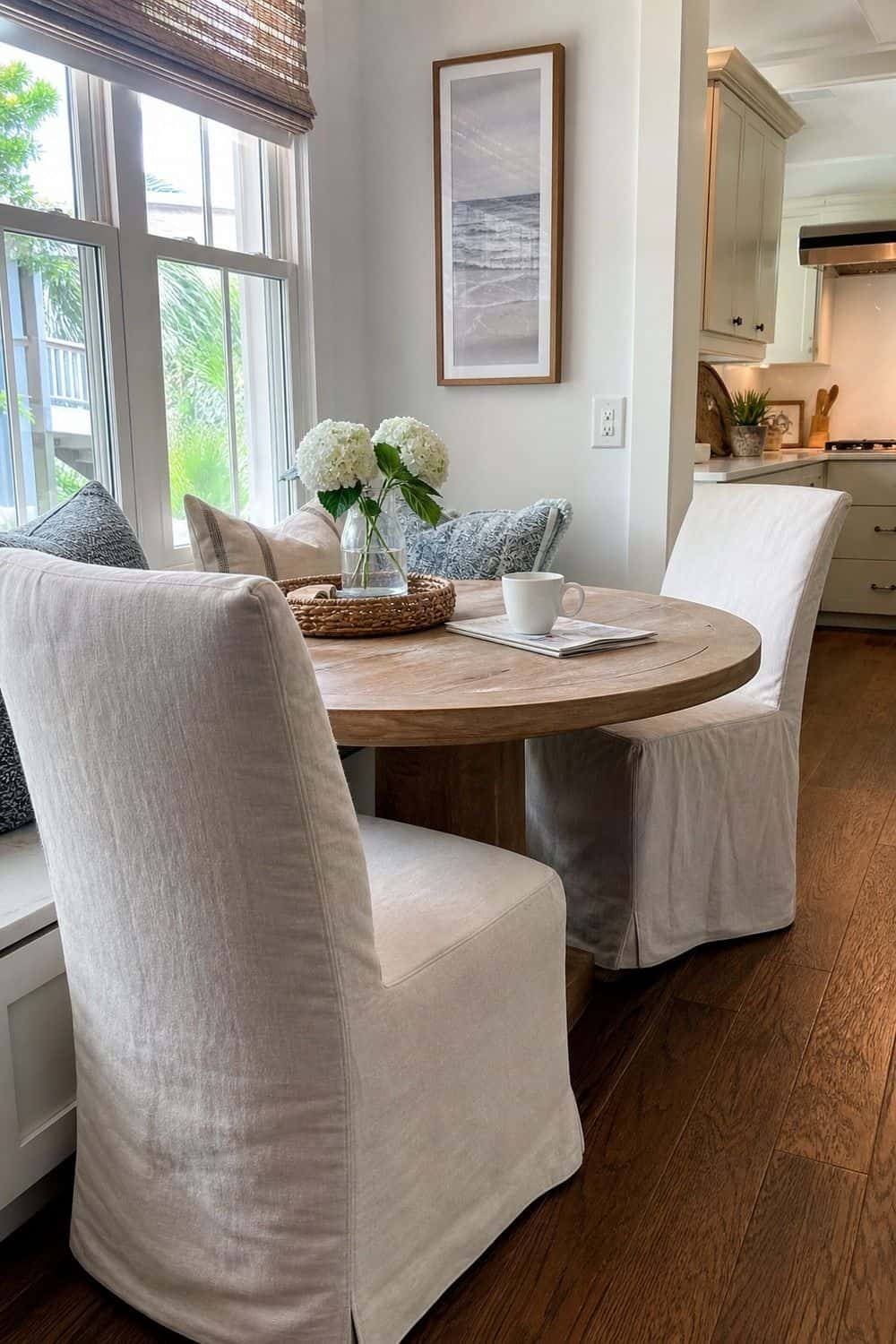 25 Coastal Kitchen Ideas for a Beautiful Kitchen Slipcovered Breakfast Nook Chairs in a casual coastal kitchen