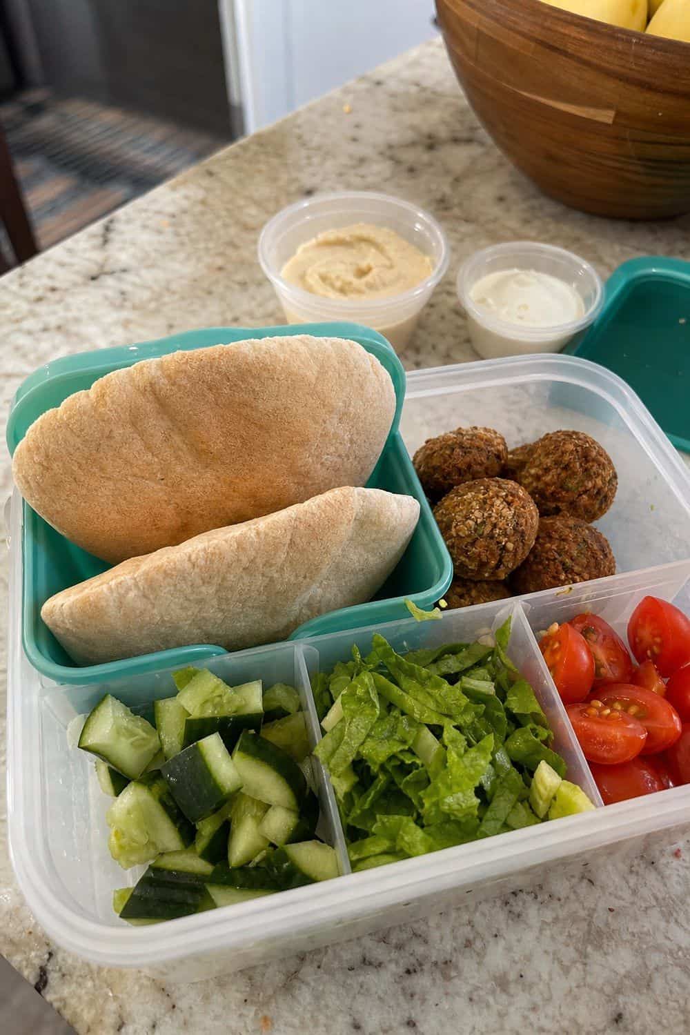 20 Cold Lunch Meal Prep Ideas That Make Life Easier 14. Pita Pocket Prep Kits cold lunch meal prep idea in a packed lunch container