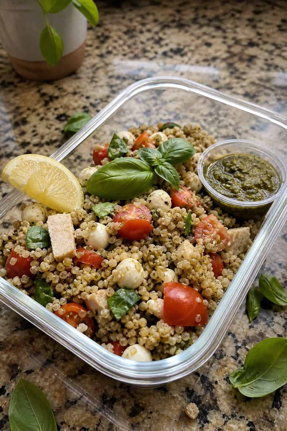 20 Cold Lunch Meal Prep Ideas That Make Life Easier 15. Caprese Pesto Grain Salads cold lunch meal prep idea in a packed lunch container
