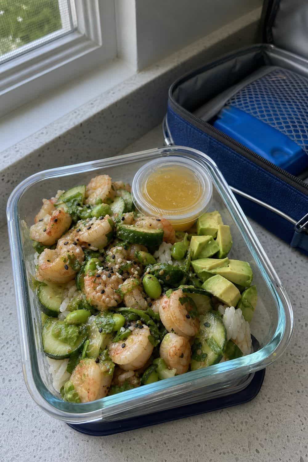 20 Cold Lunch Meal Prep Ideas That Make Life Easier 16. Shrimp Cucumber Rice Bowls cold lunch meal prep idea in a packed lunch container