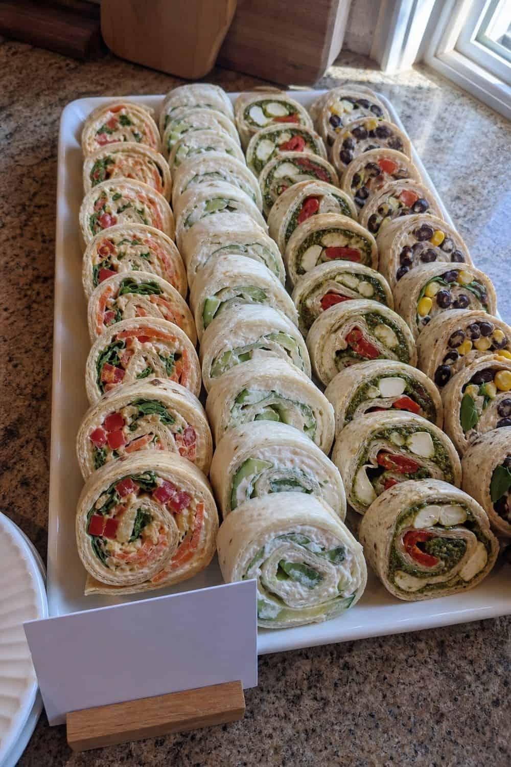 25 Graduation Party Food Ideas for a Crowd-Friendly Buffet Offer Vegetarian Pinwheel Wraps for a graduation party buffet