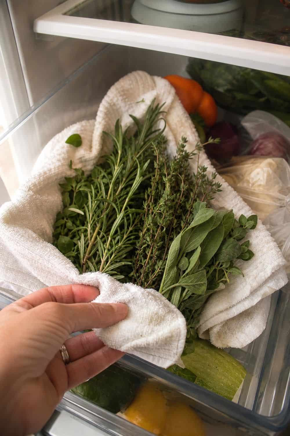 20 Herb Storage Ideas That Keep Food Fresh 5. Wrap Woody Herbs in a Towel for 20 Herb Storage Ideas That Keep Food Fresh