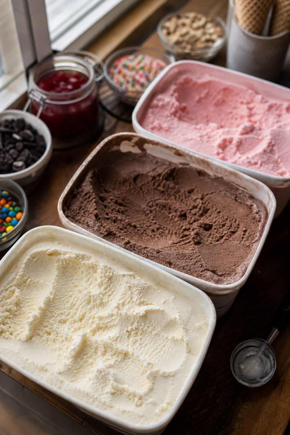 25 Ice Cream Bar Ideas for a Fun Self-Serve Dessert Table 3. Offer Three Crowd-Pleasing Base Flavors setup for an ice cream bar