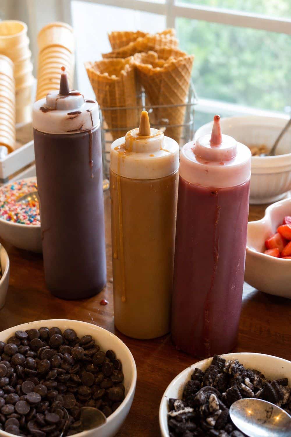 25 Ice Cream Bar Ideas for a Fun Self-Serve Dessert Table 5. Use Squeeze Bottles for Chocolate and Caramel setup for an ice cream bar