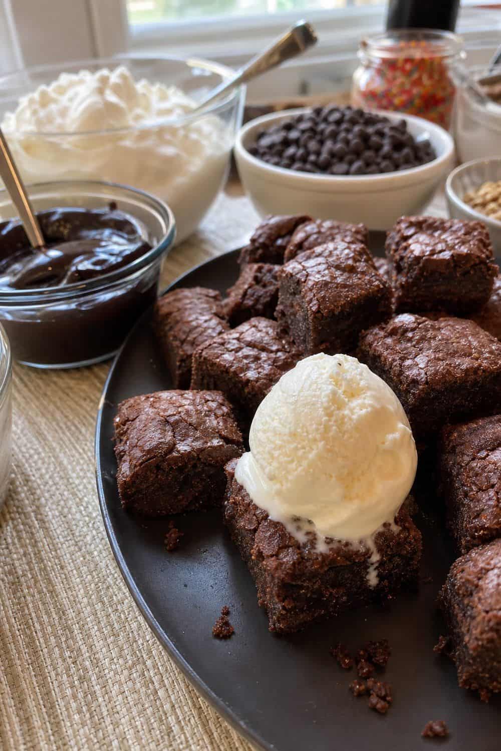 25 Ice Cream Bar Ideas for a Fun Self-Serve Dessert Table 8. Serve Brownie Bites as a Sundae Base setup for an ice cream bar