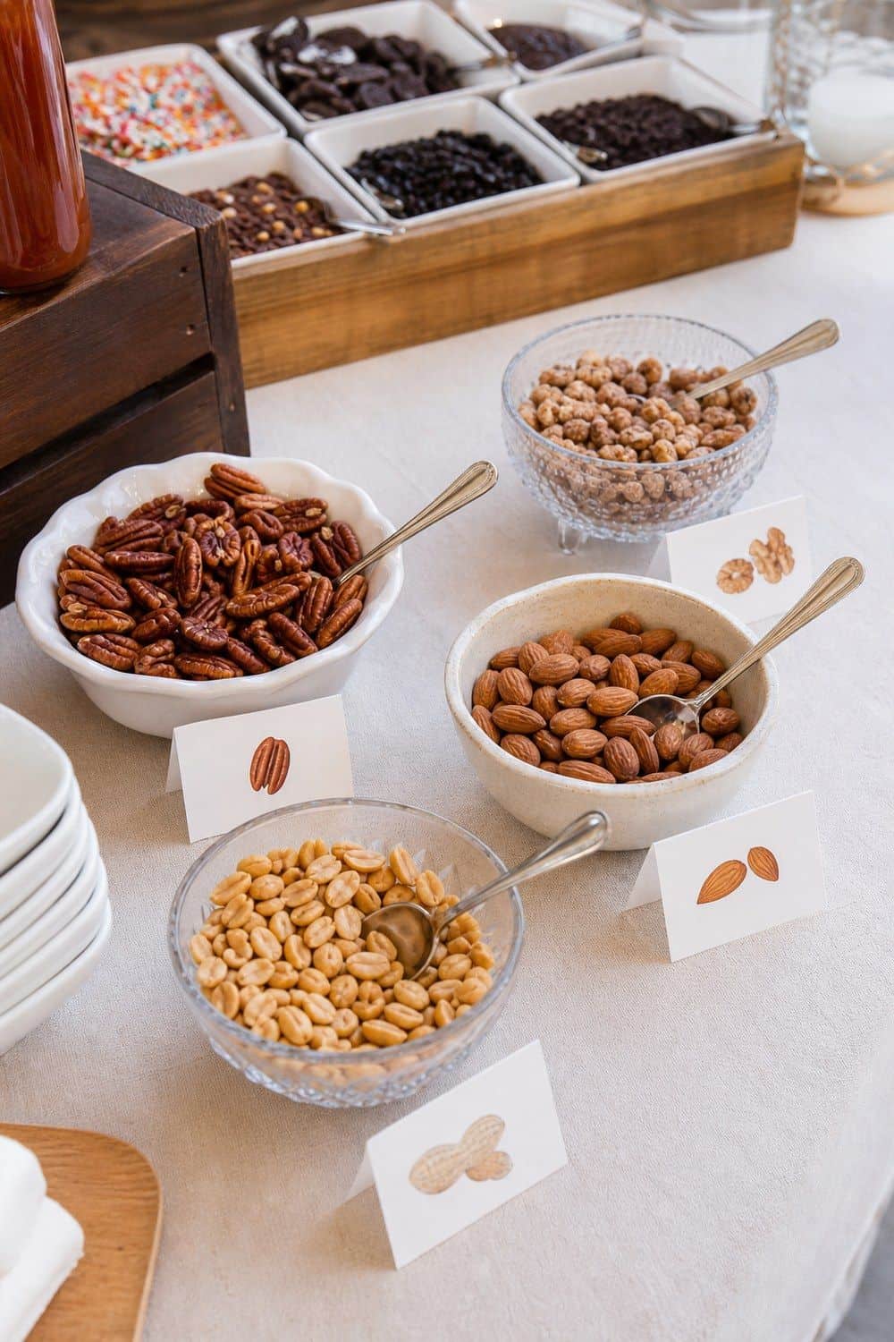 25 Ice Cream Bar Ideas for a Fun Self-Serve Dessert Table 15. Separate Nut Toppings With Clear Labels setup for an ice cream bar