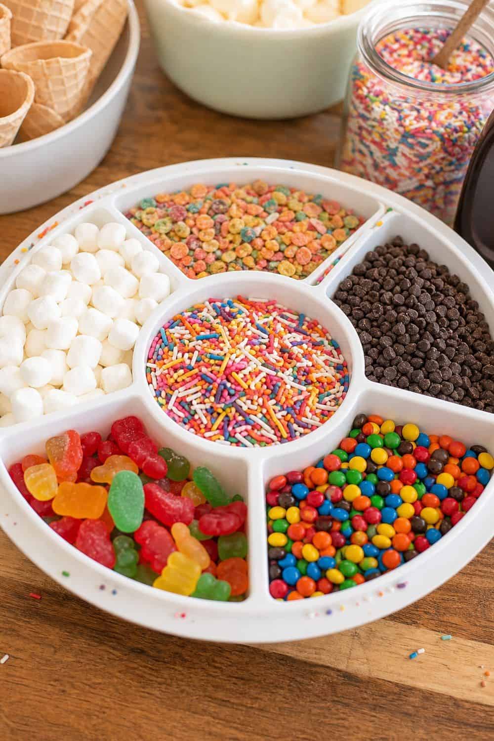 25 Ice Cream Bar Ideas for a Fun Self-Serve Dessert Table 16. Build a Kids’ Sprinkle Tray setup for an ice cream bar
