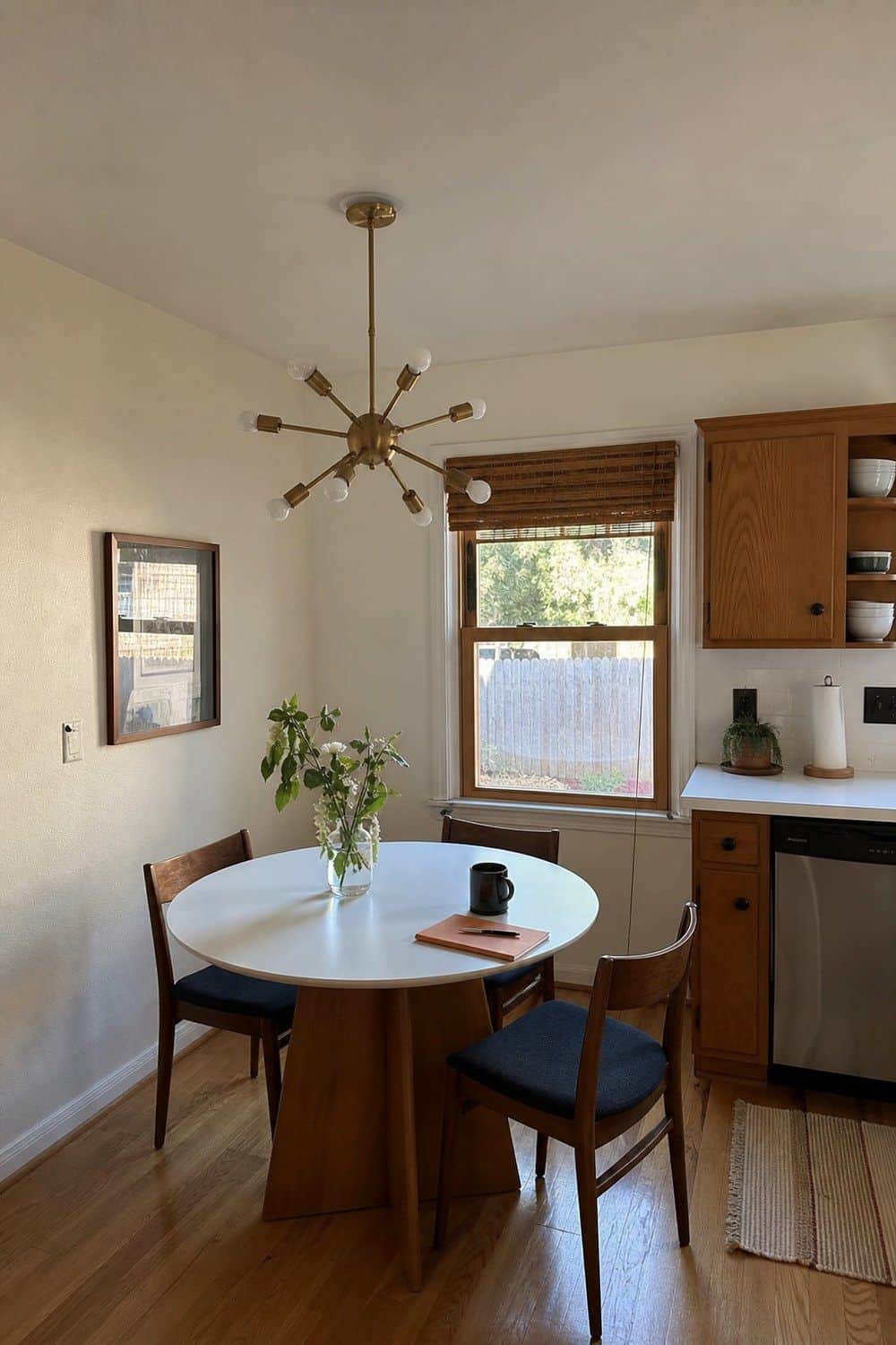 6. Sputnik-Inspired Fixture With Breathing Room in a casual mid-century modern kitchen with realistic retro warmth and everyday home details