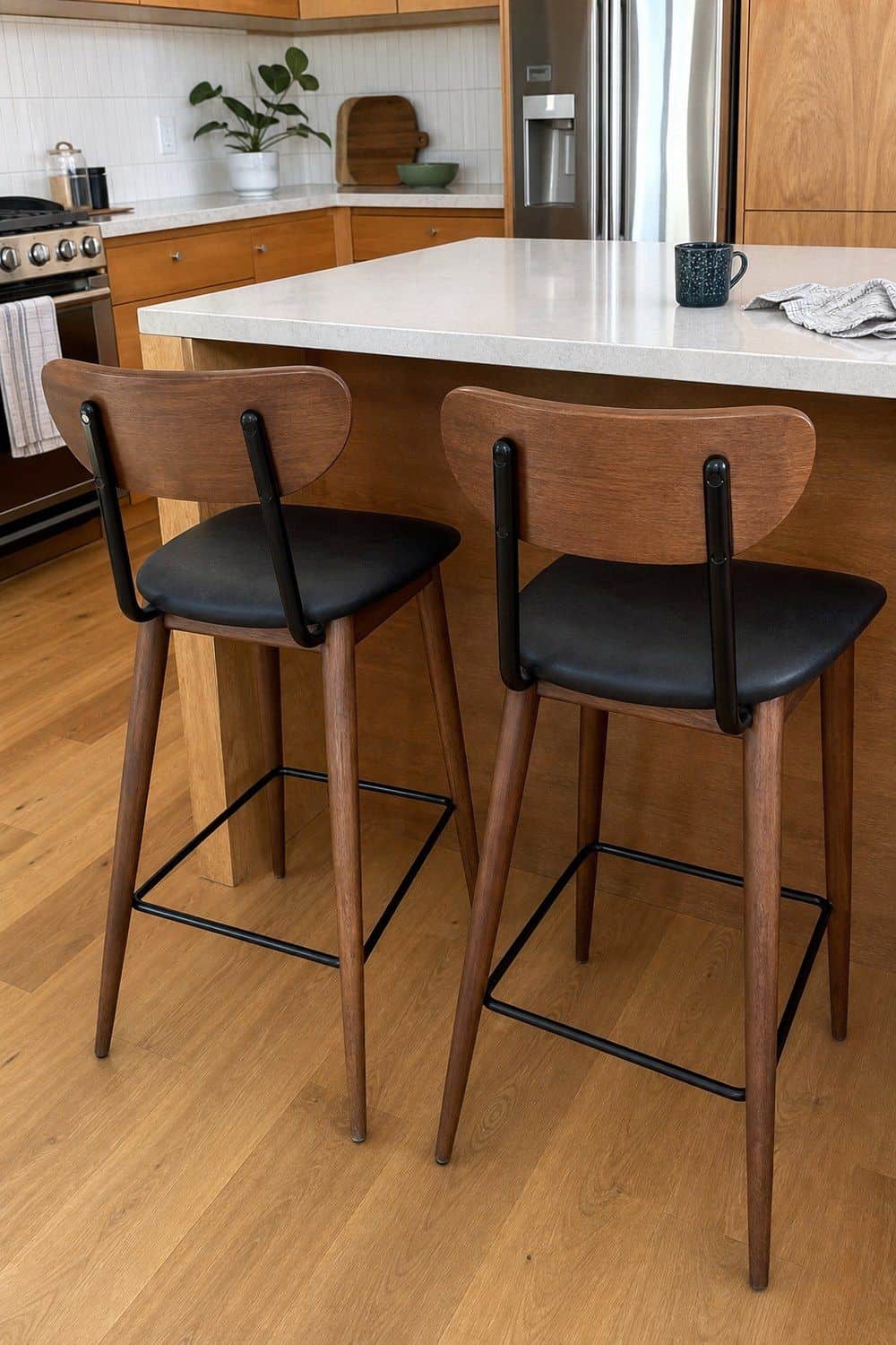 14. Leggy Counter Stools in a casual mid-century modern kitchen with realistic retro warmth and everyday home details
