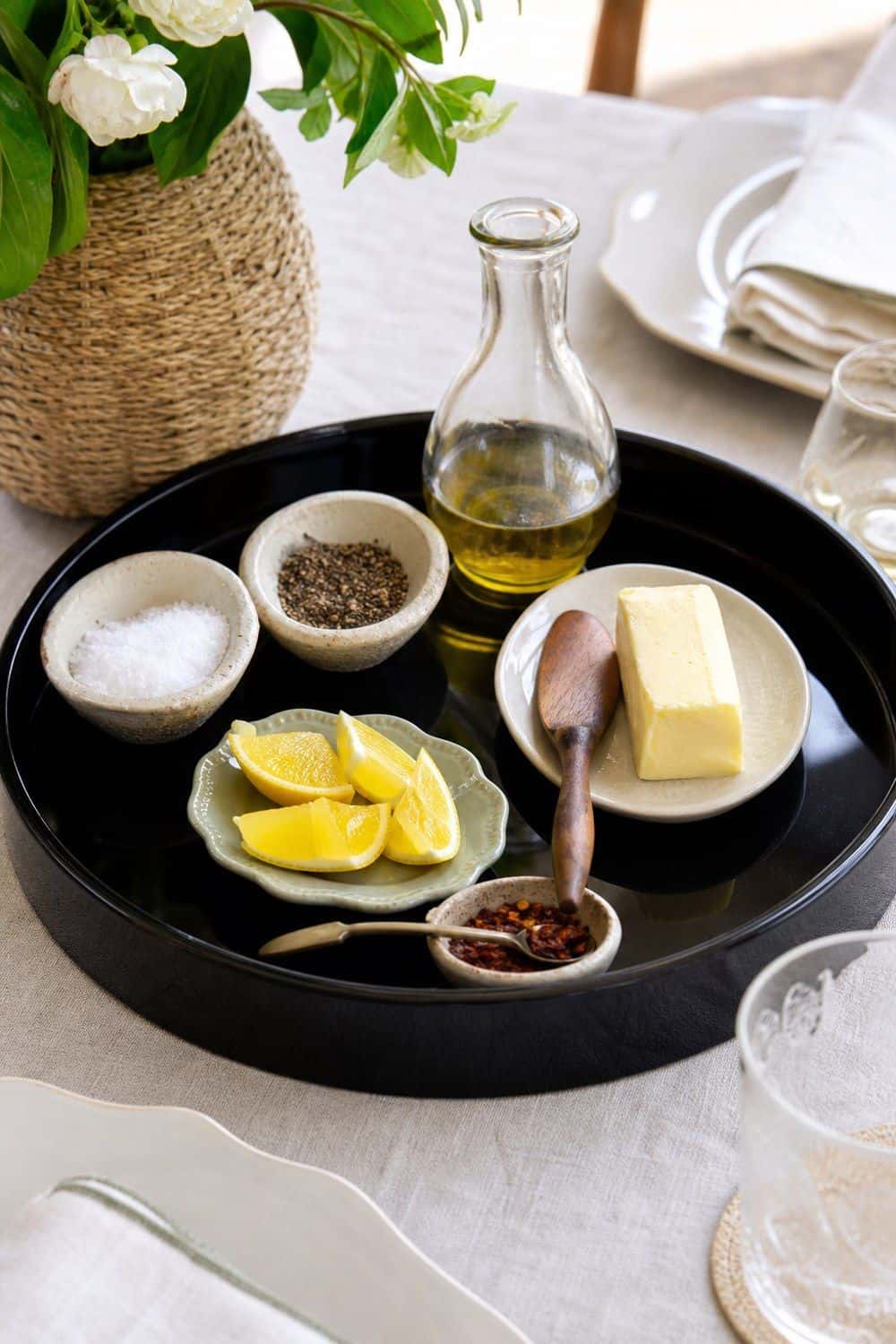 25 Neo Deco Tablescape Ideas for Easy Hosting Condiments Gathered on One Lacquer Tray in a casual Neo Deco tablescape