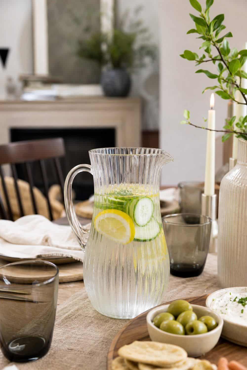 25 Neo Deco Tablescape Ideas for Easy Hosting A Fluted Pitcher That Keeps Water Moving in a casual Neo Deco tablescape