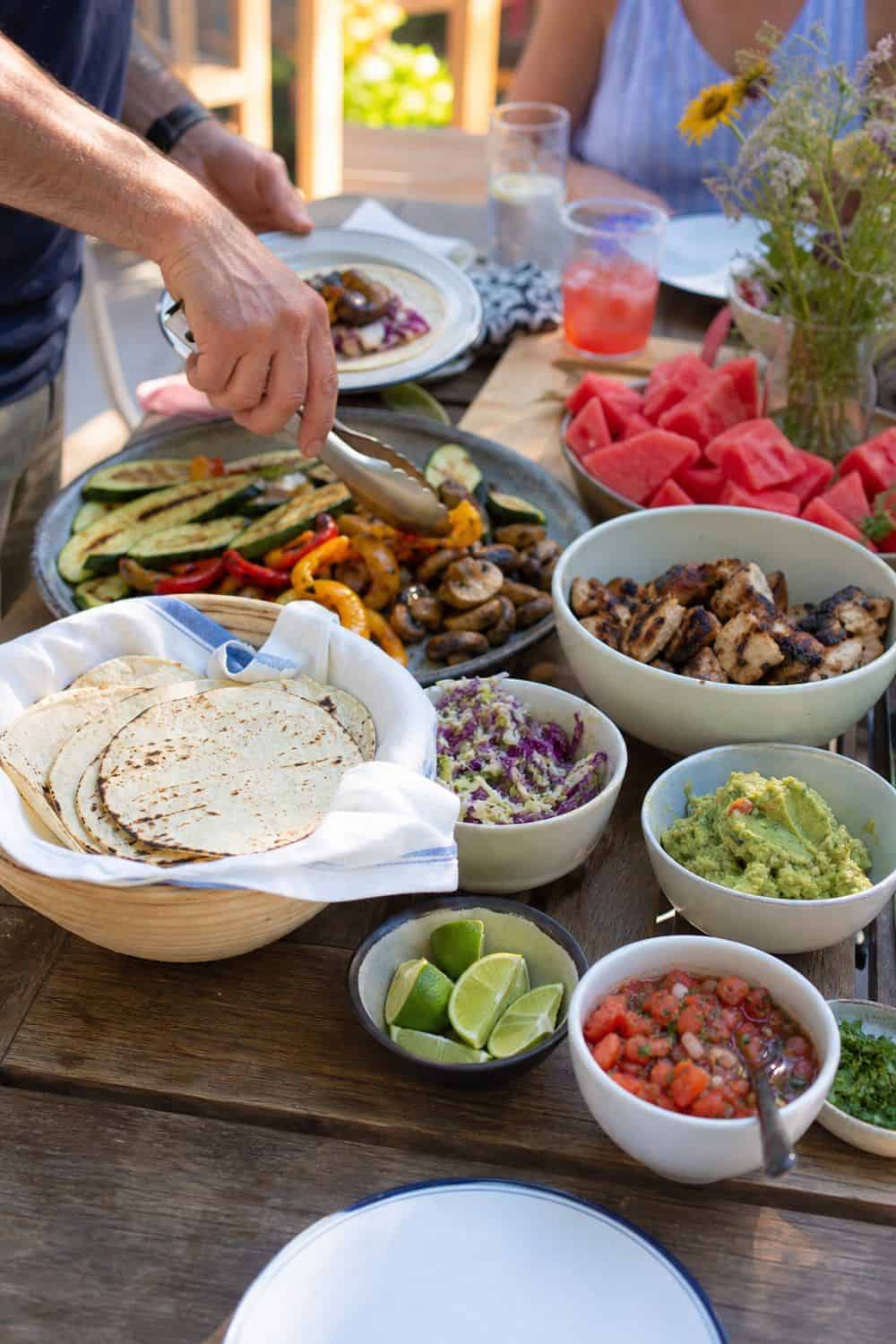 25 Summer Dinner Party Menu Ideas for Warm-Weather Hosting taco spread with grilled vegetables for a summer dinner party menu