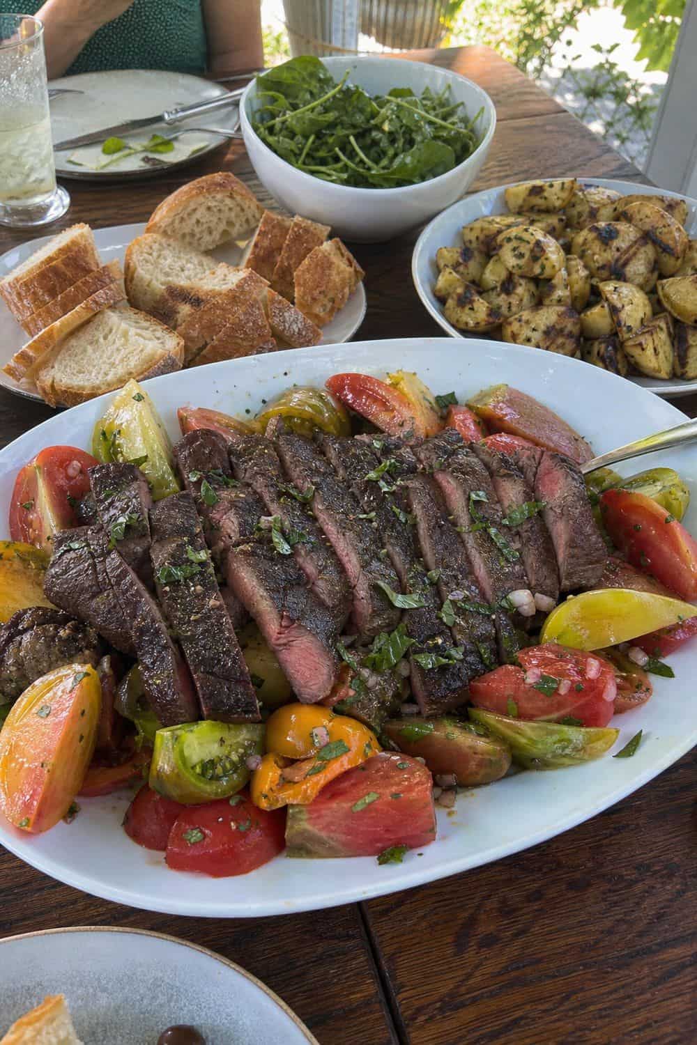 25 Summer Dinner Party Menu Ideas for Warm-Weather Hosting steak and heirloom tomato dinner for a summer dinner party menu