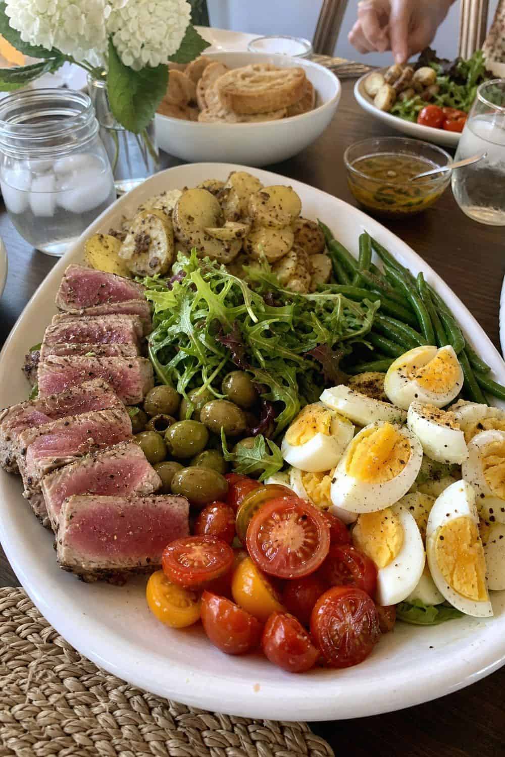 25 Summer Dinner Party Menu Ideas for Warm-Weather Hosting nicoise-inspired platter supper for a summer dinner party menu