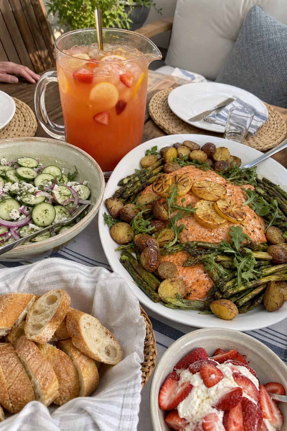 25 Summer Dinner Party Menu Ideas for Warm-Weather Hosting pitcher drink and family-style platter menu for a summer dinner party menu