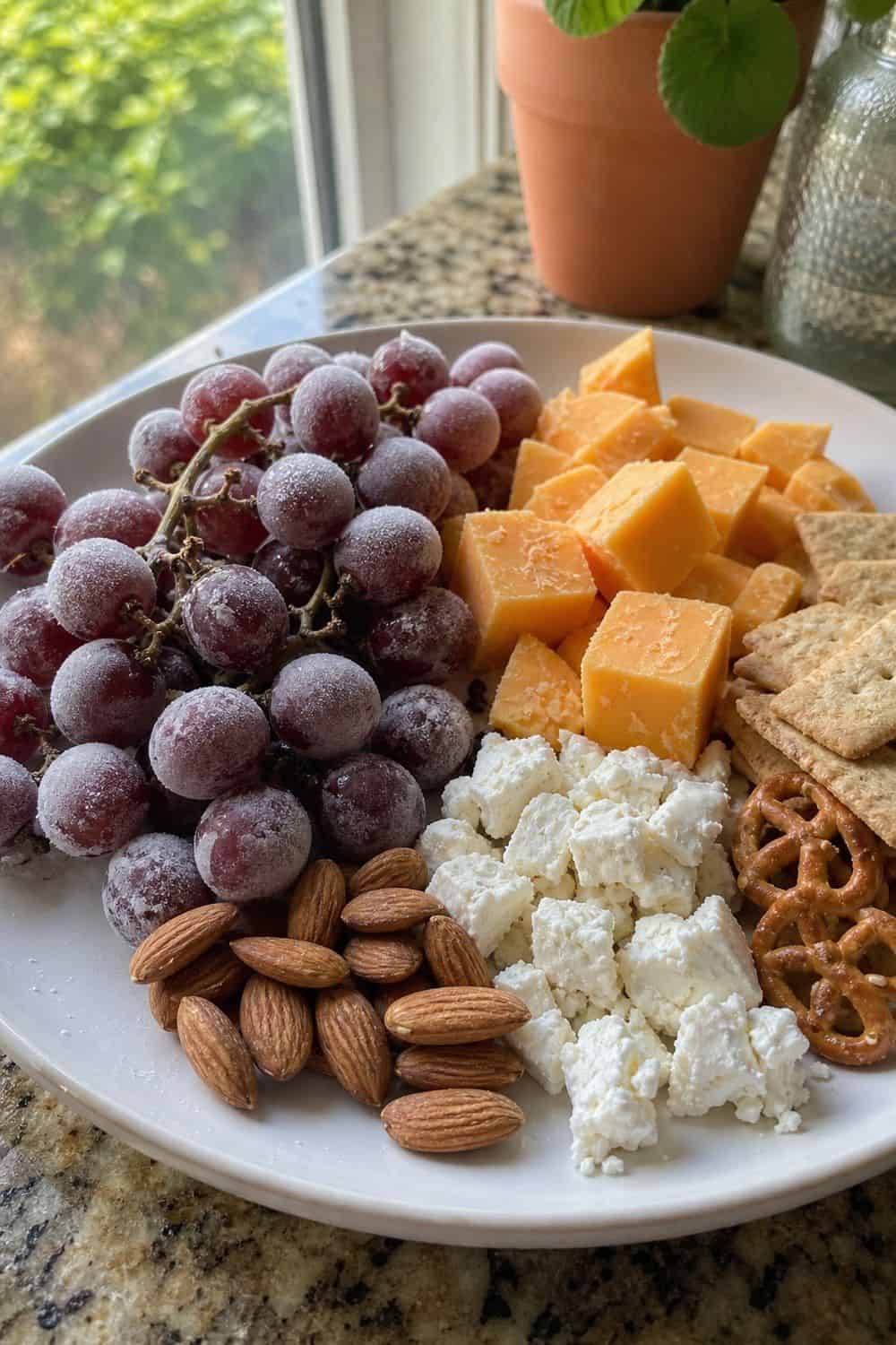 20 Summer Snack Plate Ideas for Hot Weather 5. Frozen Grapes and Cheese Plate summer snack plate