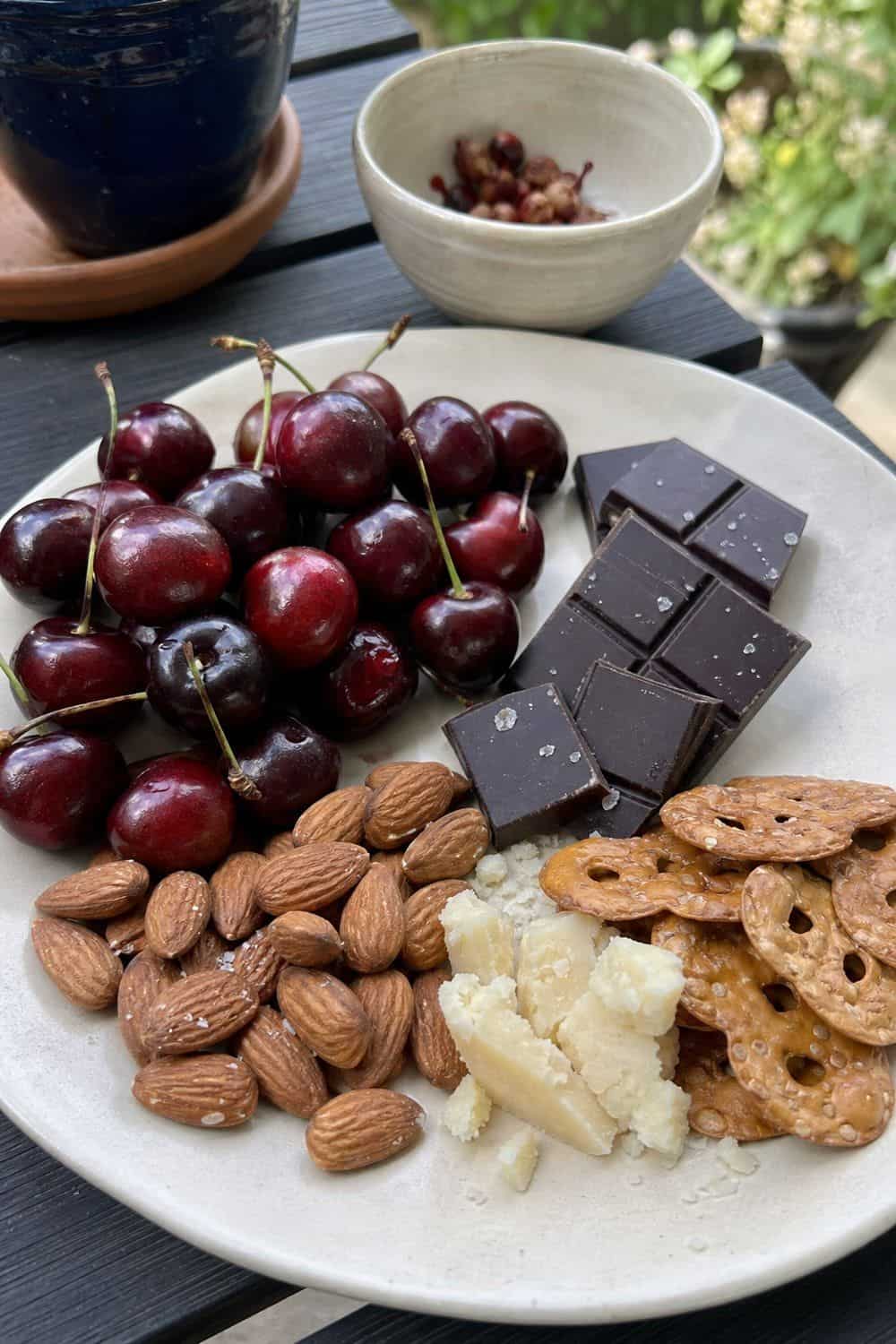 20 Summer Snack Plate Ideas for Hot Weather 18. Cherry Almond Dark Chocolate Plate summer snack plate