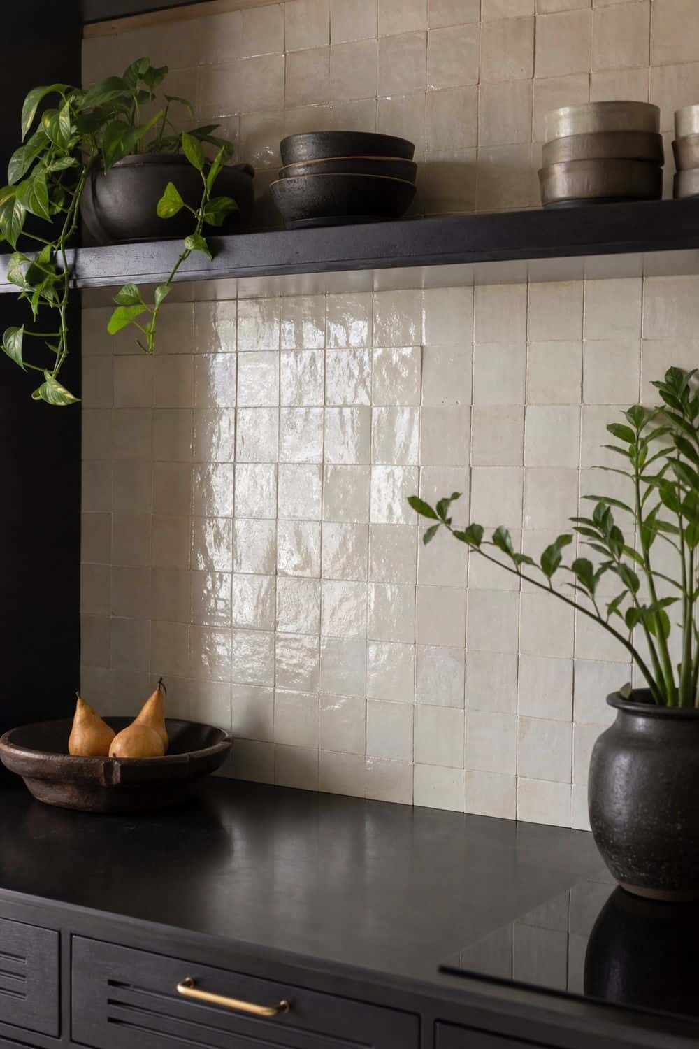 25 Black Kitchen Ideas for a Beautiful Kitchen 11. Pair with Zellige shown in a warm black kitchen with practical home styling