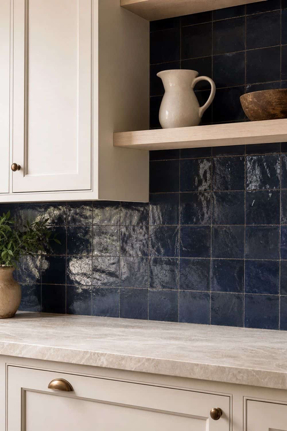 25 Blue Zellige Kitchen Ideas: Shades, Grout and Pairings Navy zellige backsplash with a pale stone counter