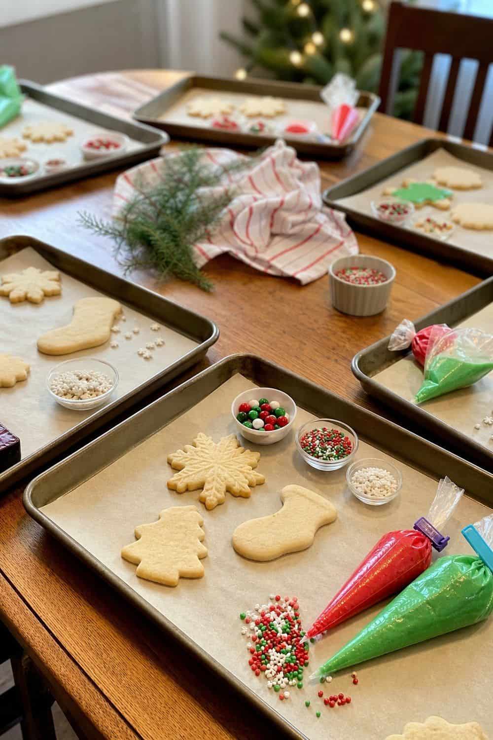 25 Christmas Cookie Decorating Party Ideas for Easy Hosting Sheet Pans as Decorating Trays setup for a Christmas cookie decorating party