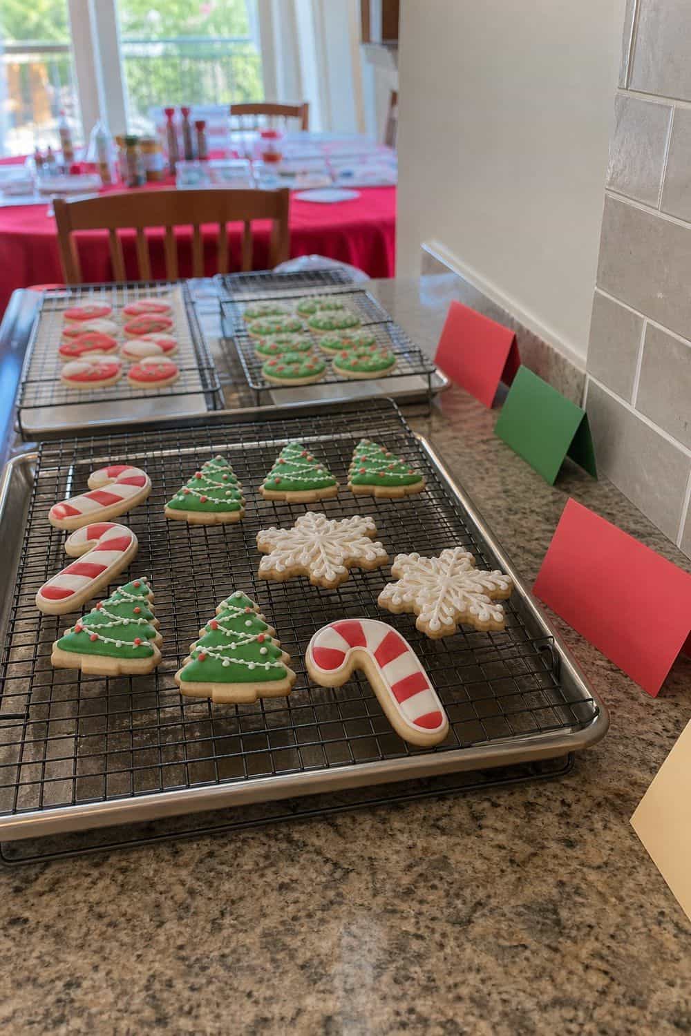25 Christmas Cookie Decorating Party Ideas for Easy Hosting A Drying Rack Zone setup for a Christmas cookie decorating party