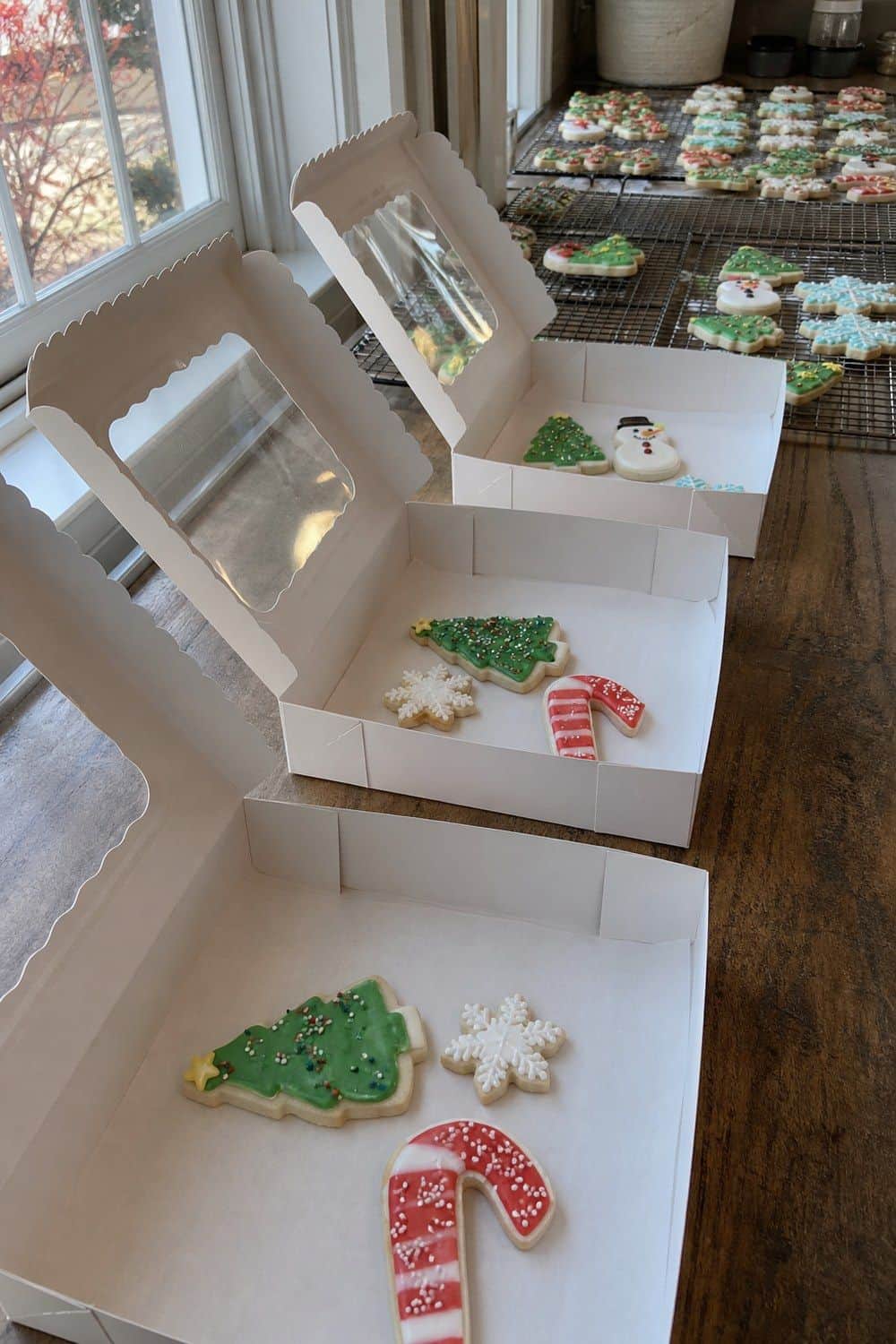 25 Christmas Cookie Decorating Party Ideas for Easy Hosting Cookie Boxes Before Guests Leave setup for a Christmas cookie decorating party