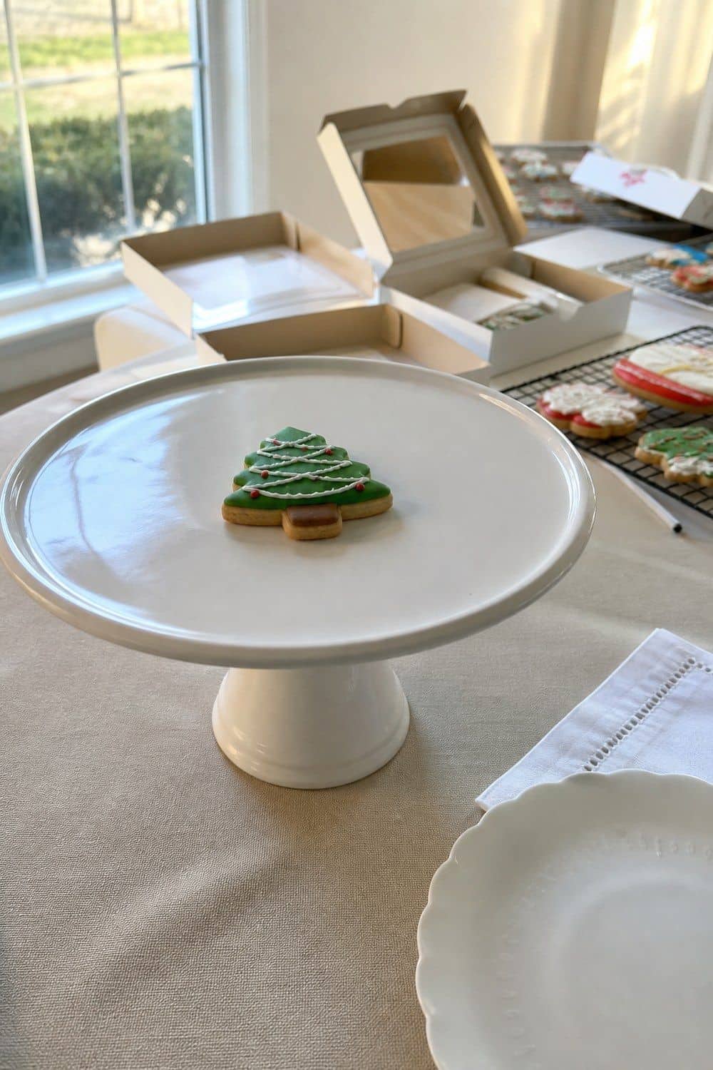 25 Christmas Cookie Decorating Party Ideas for Easy Hosting Photo Spot Before Boxes Close setup for a Christmas cookie decorating party