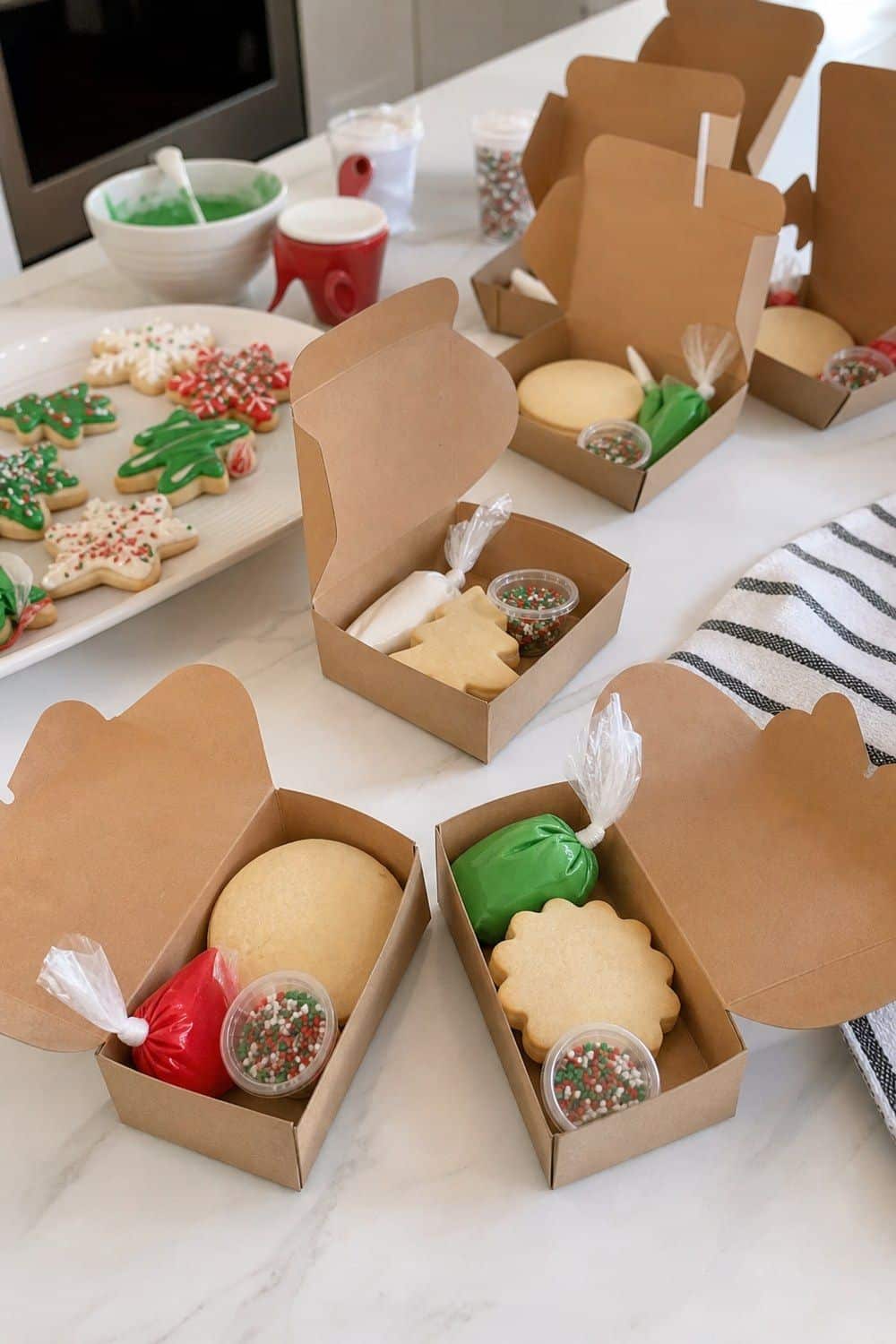 25 Christmas Cookie Decorating Party Ideas for Easy Hosting Mini Decorating Kit for Guests to Take Home setup for a Christmas cookie decorating party