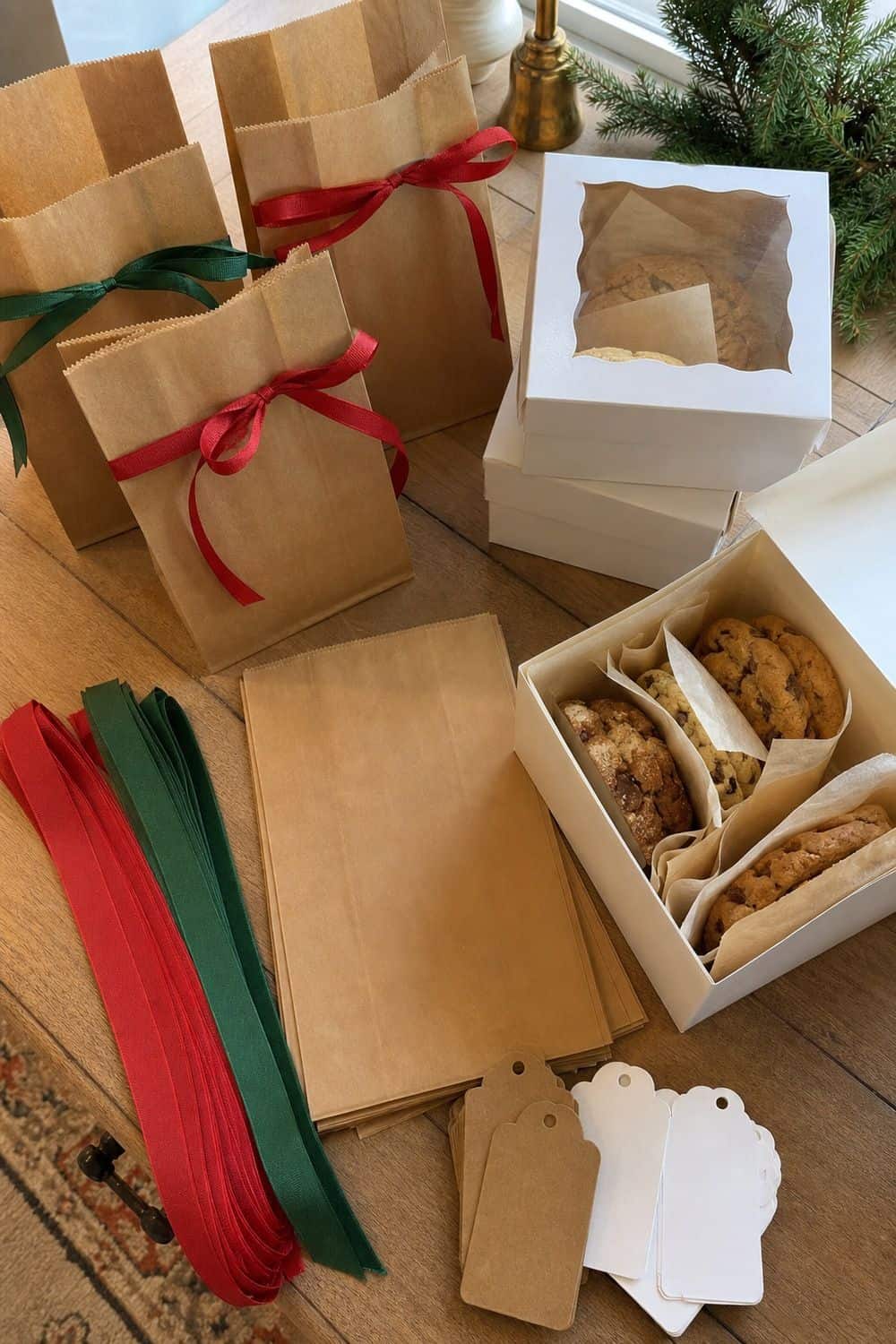 25 Christmas Cookie Party Hosting Ideas for Easy Hosting Bags, Ribbon, and Tags setup for a Christmas cookie party hosting table