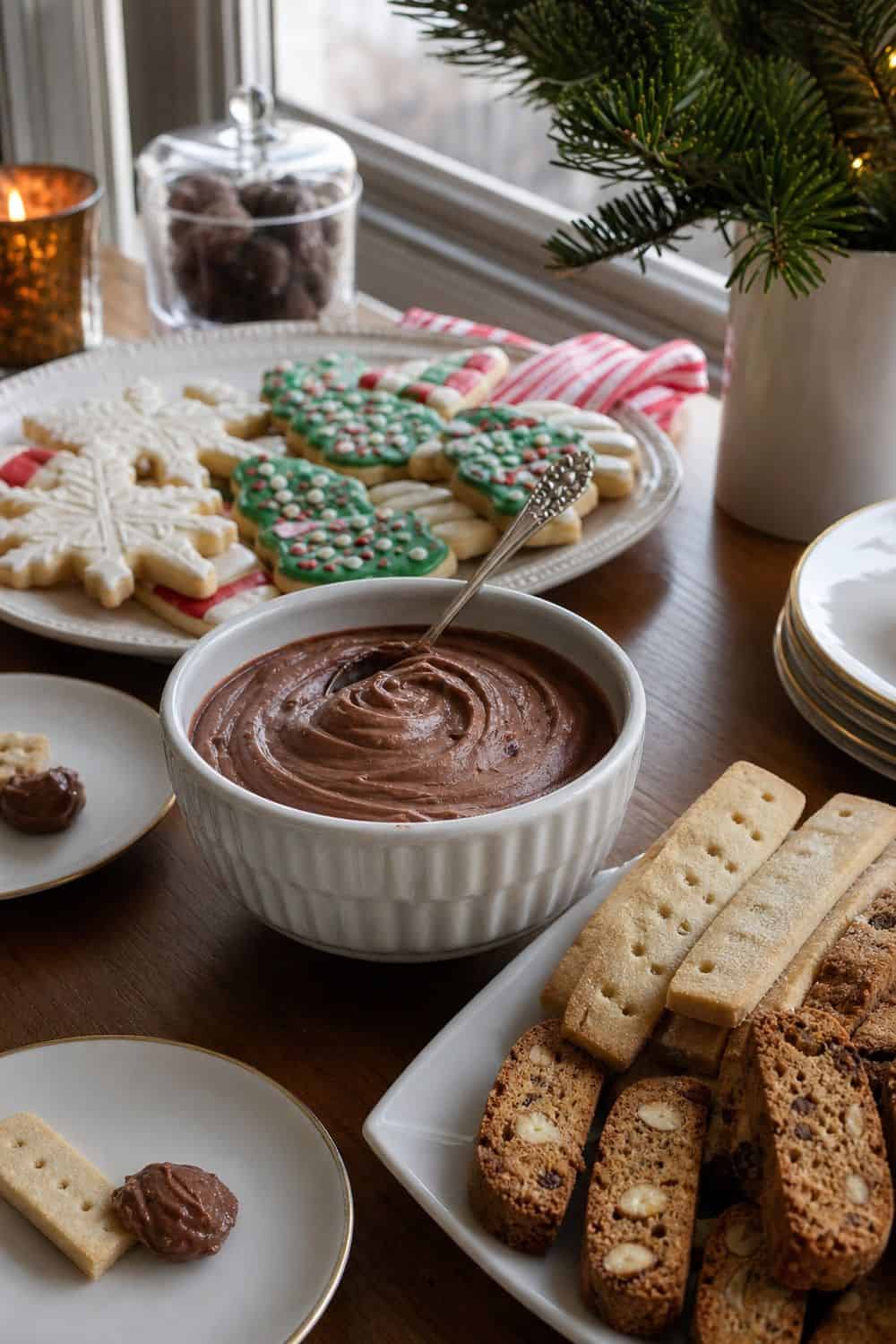 25 Christmas Cookie Party Hosting Ideas for Easy Hosting Cookie Dip Bowl for Extra Fun setup for a Christmas cookie party hosting table